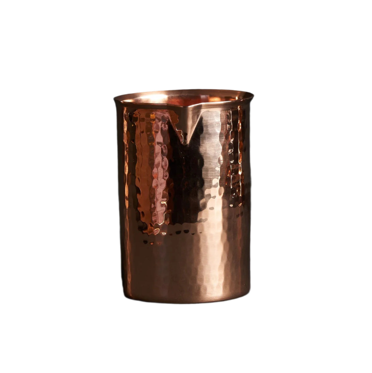 Copper tumbler with a textured surface on a dark background