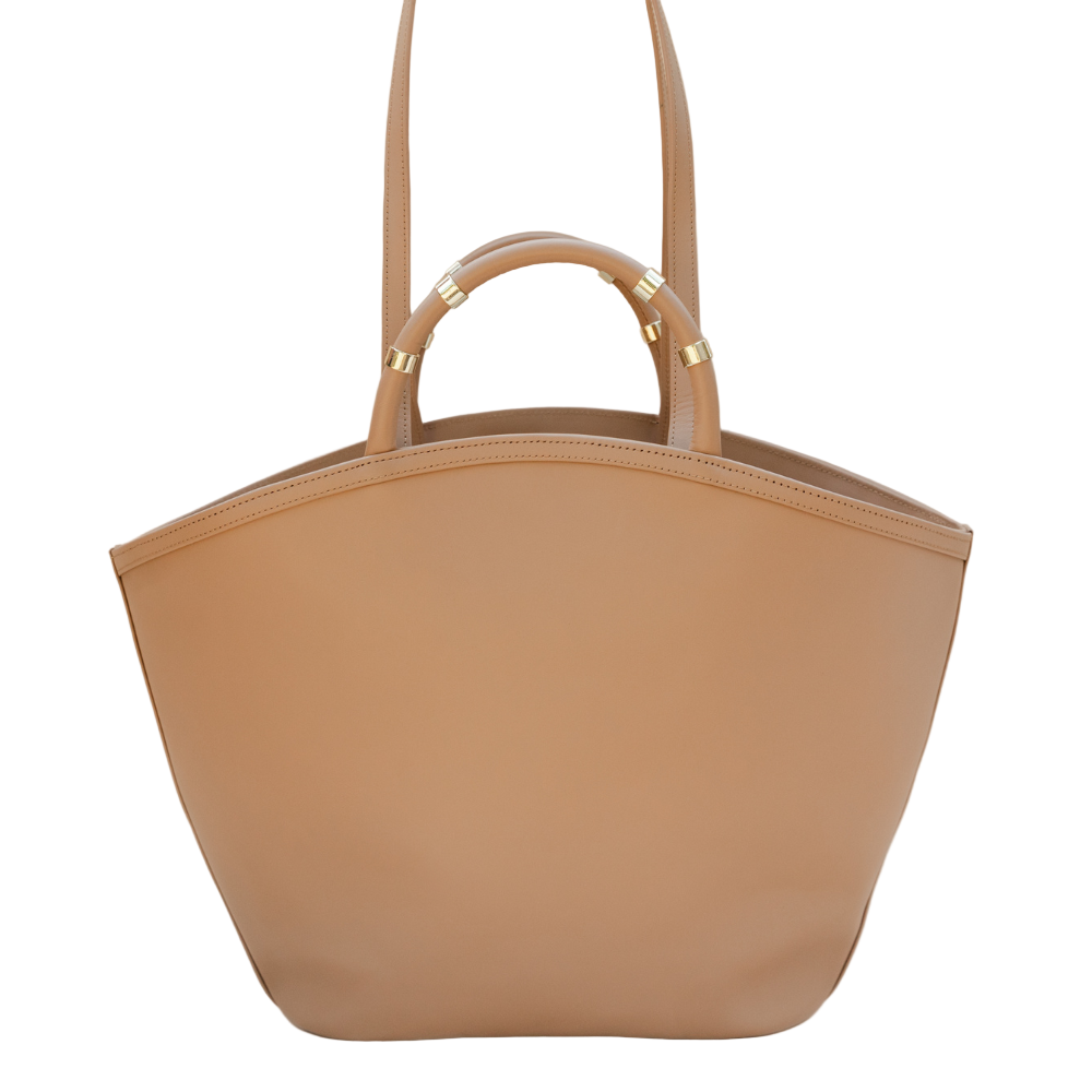 Tan handbag with gold accents on a beige background