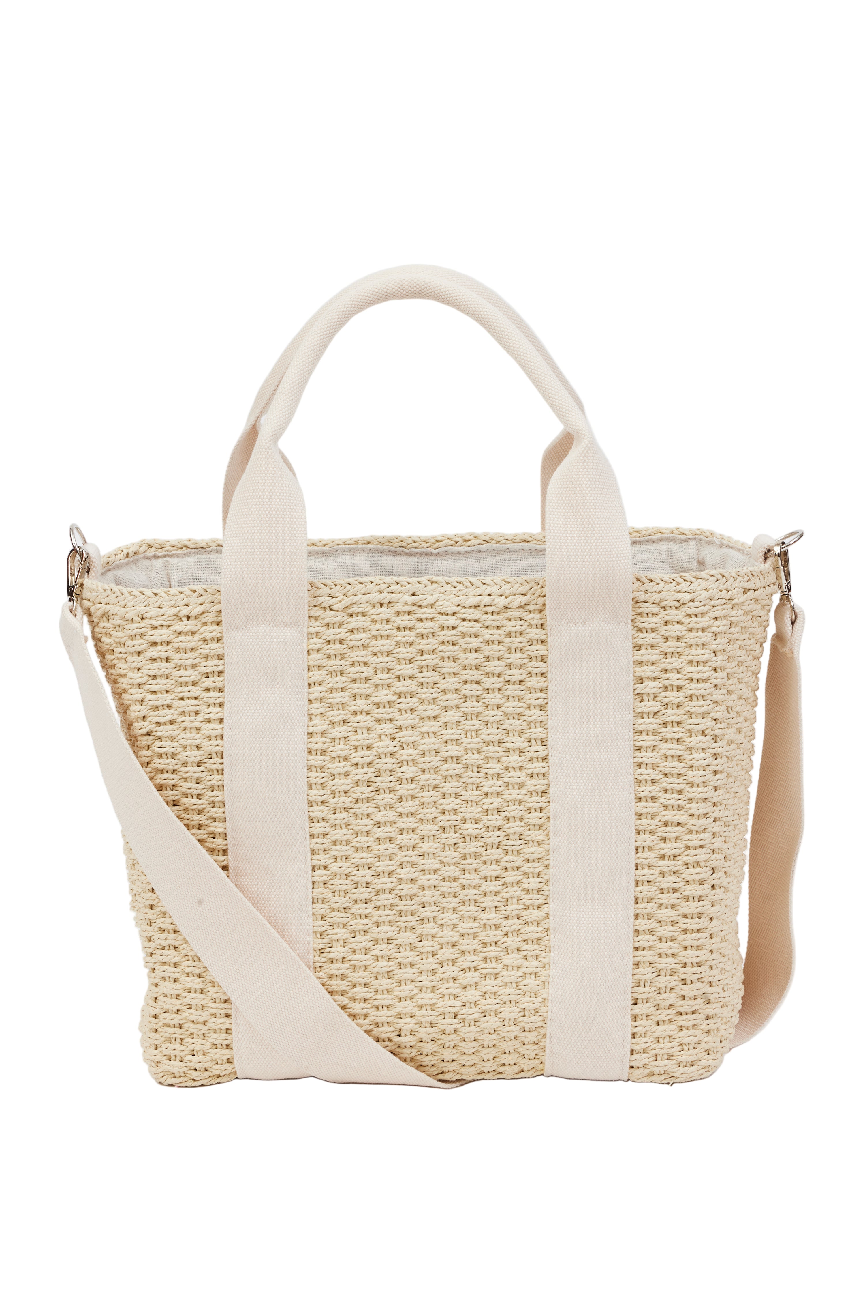 Woven bag with beige handle and strap on a white background