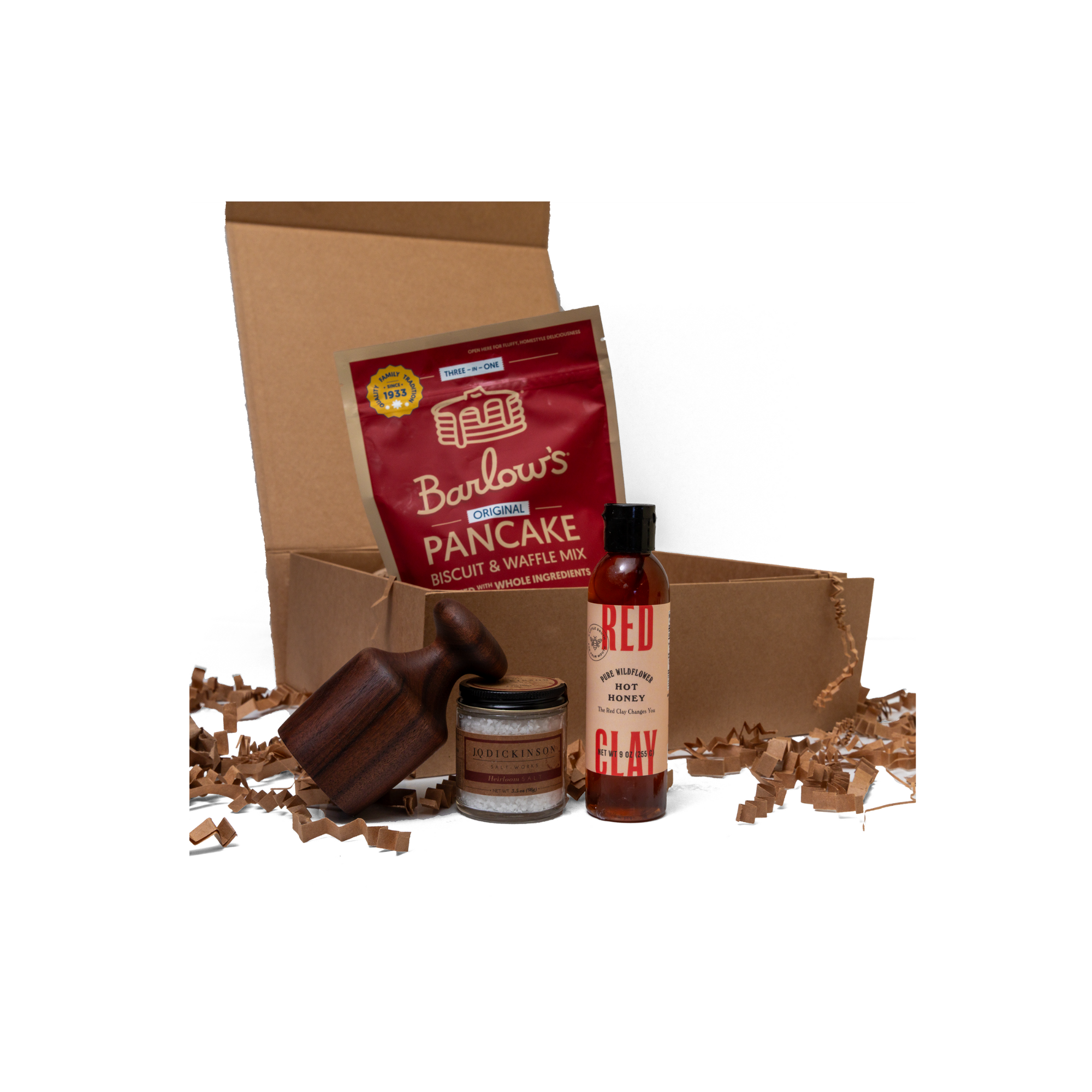 Barlow's Pancake Mix with a biscuit cutter and Honey on a white background