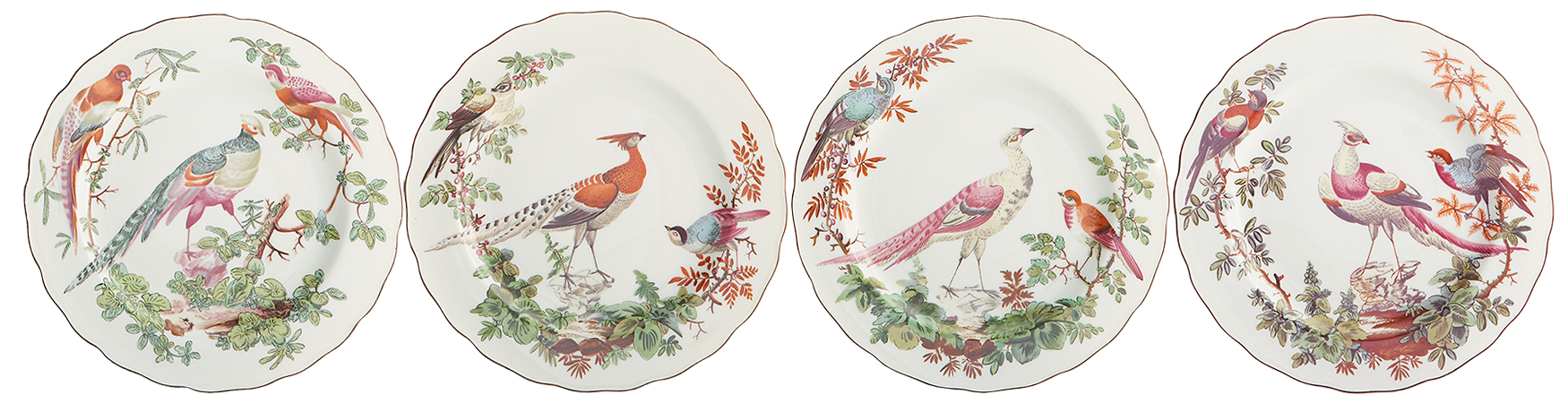 Set of four decorative plates with bird illustrations on a white background