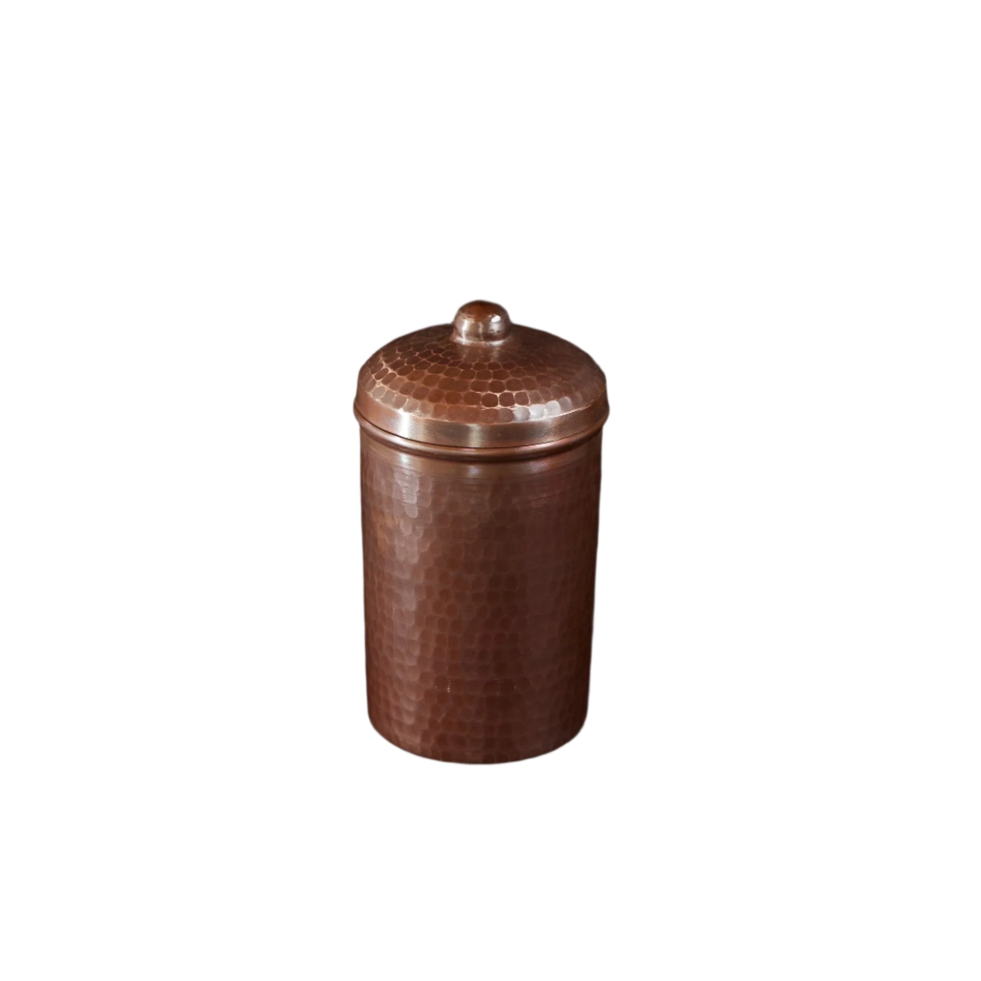Brown ceramic jar with a textured lid on a black background