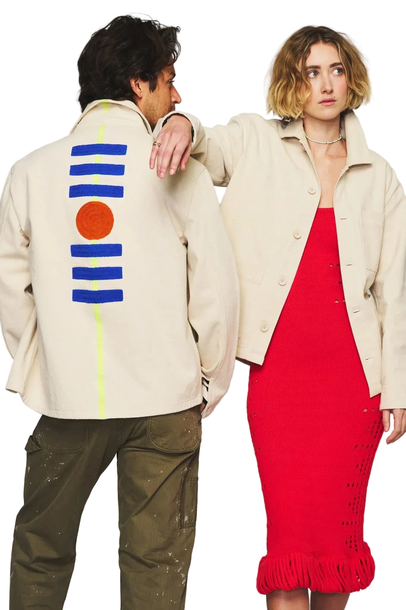 Two people wearing stylish outfits with a focus on clothing design.