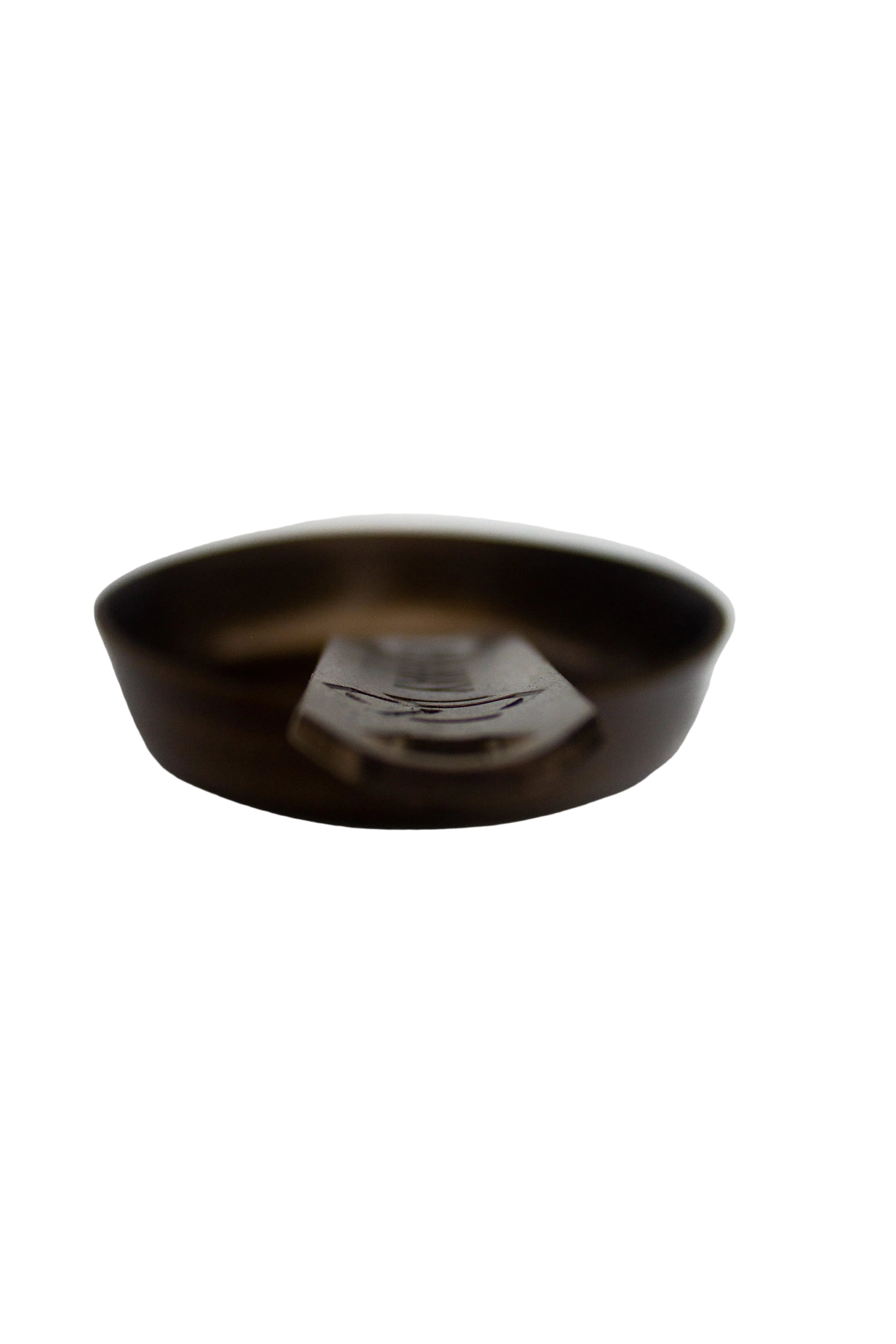 Black circular object on a white background