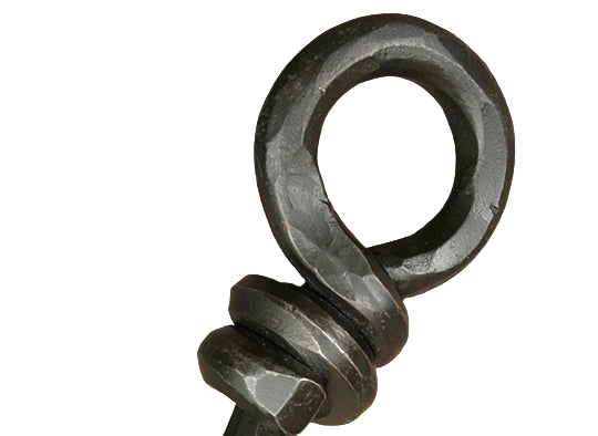 Metal eye bolt on a wooden surface