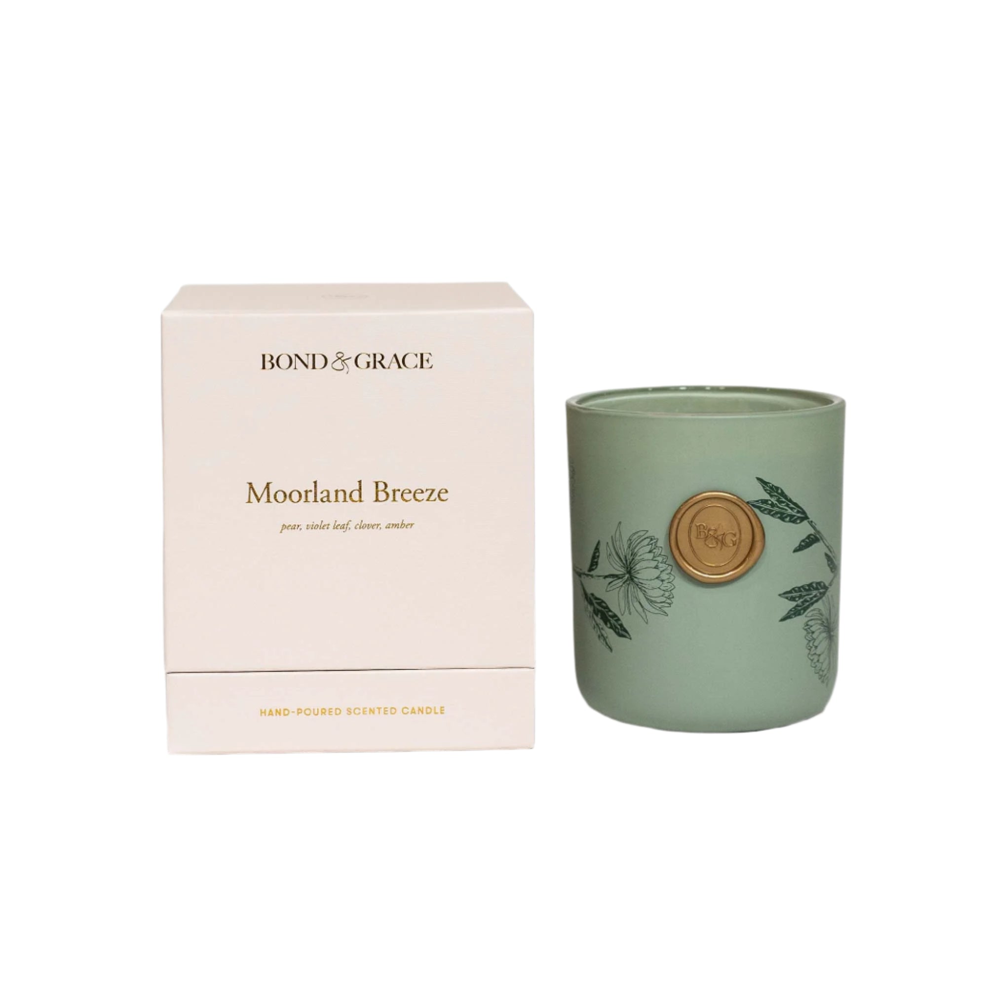 Green candle with 'Bond & Grace' branding next to its packaging on a white background