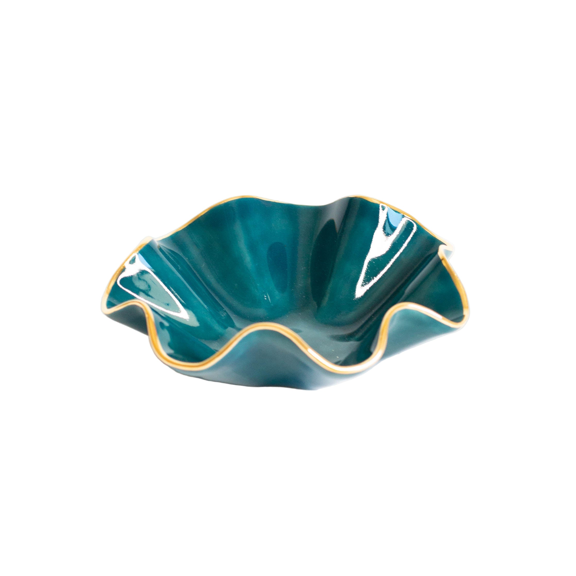 Teal ceramic dish with wavy edge on a white background