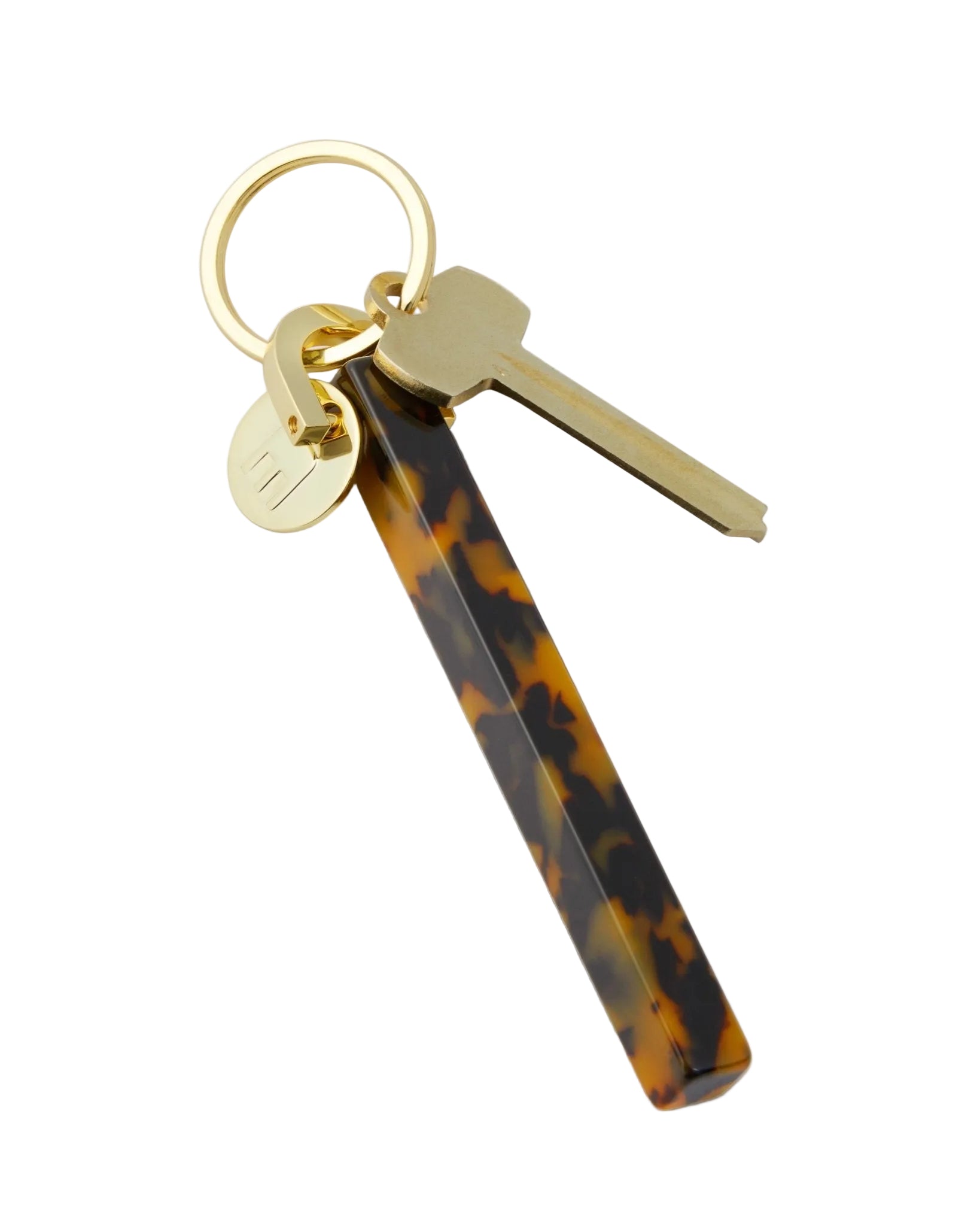 Keychain with tortoiseshell key holder and gold key on a white background