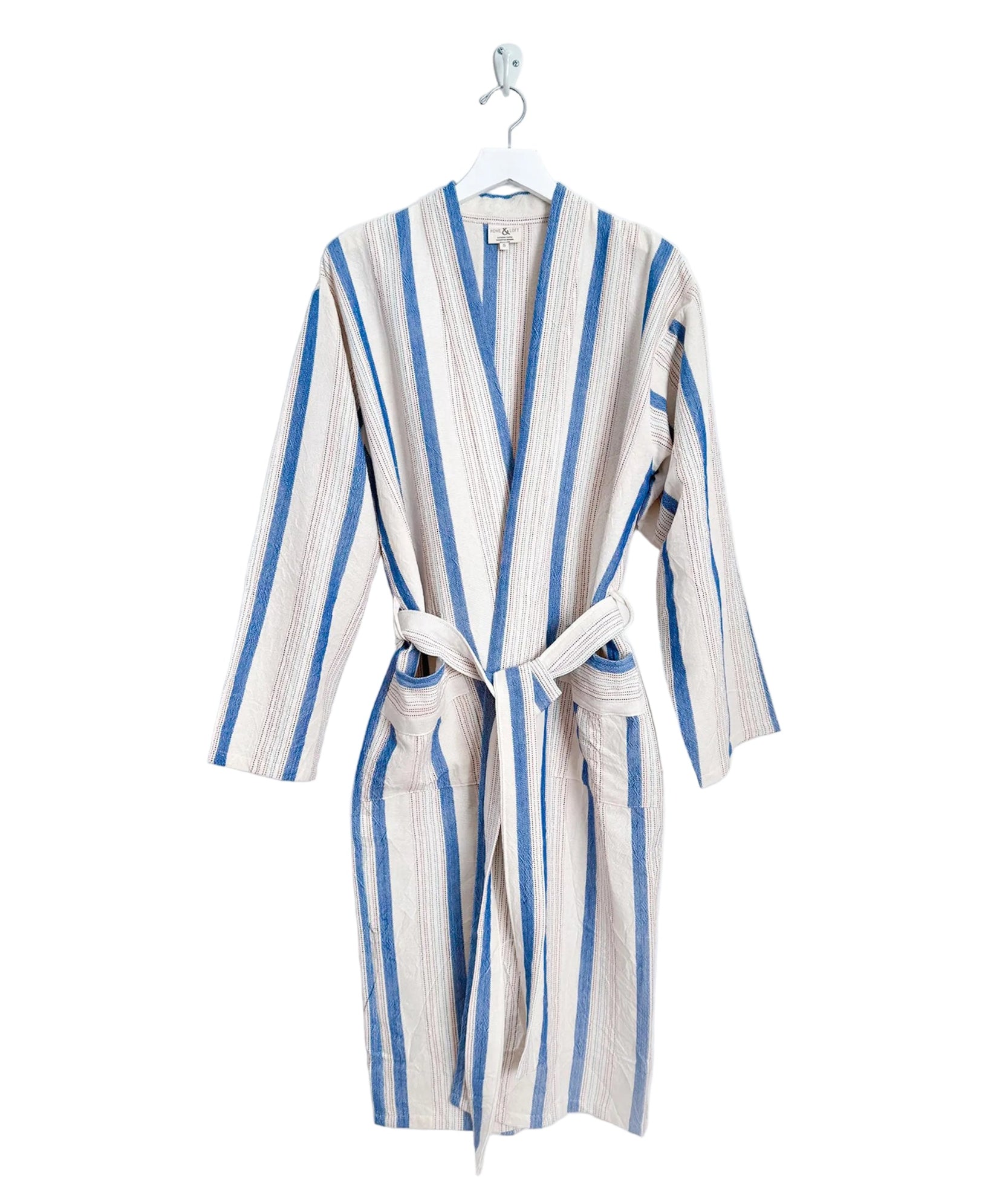 Striped robe hanging on a white background