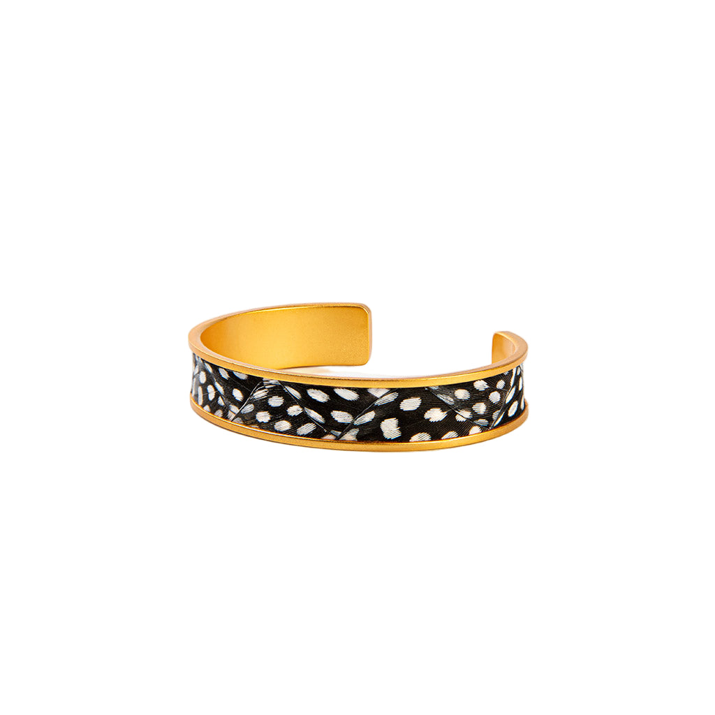 Cuff bracelet with black and white pattern on a white background
