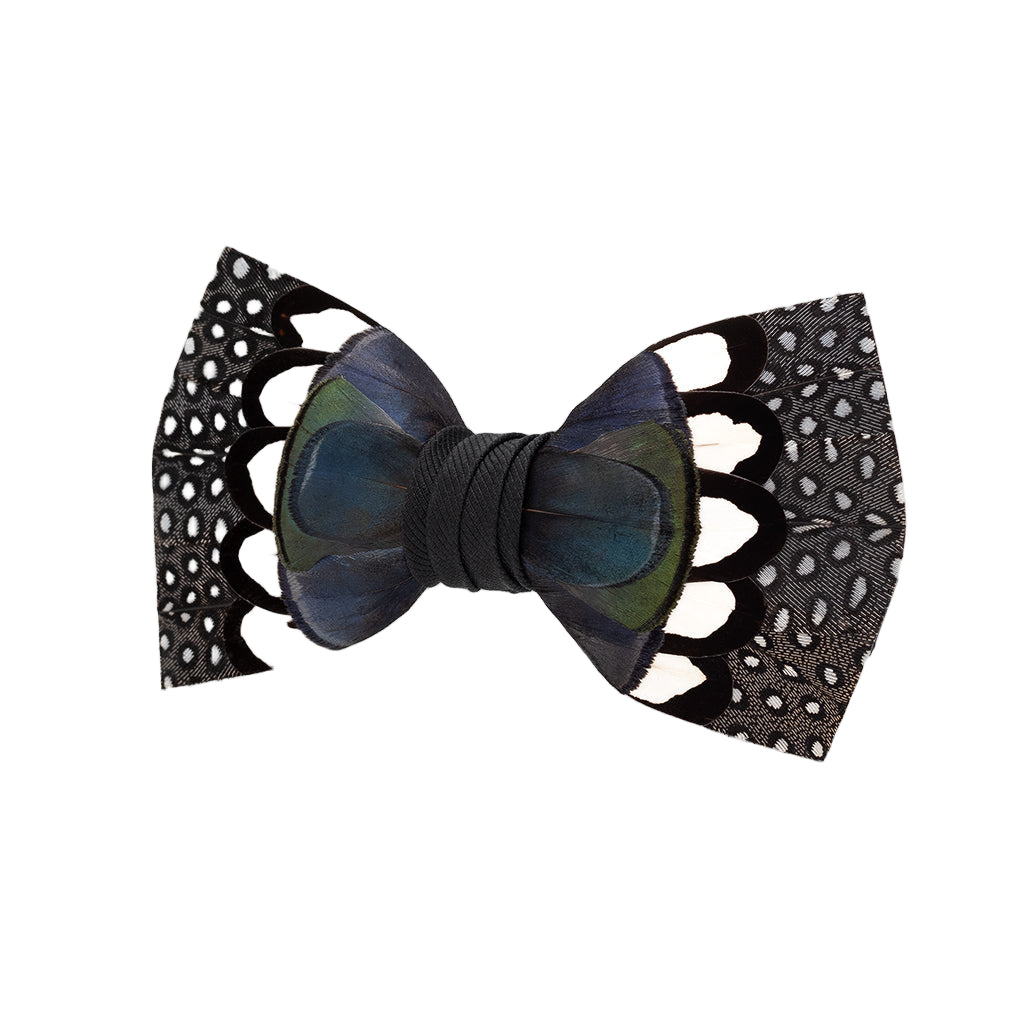 Black bow tie with peacock feather design on a white background