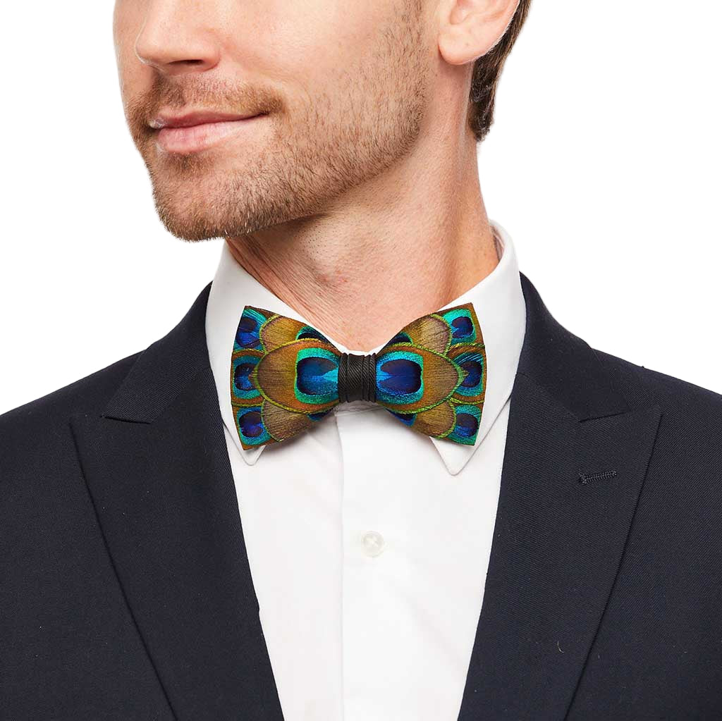 Man wearing a peacock feather bow tie with a white shirt and black suit jacket.