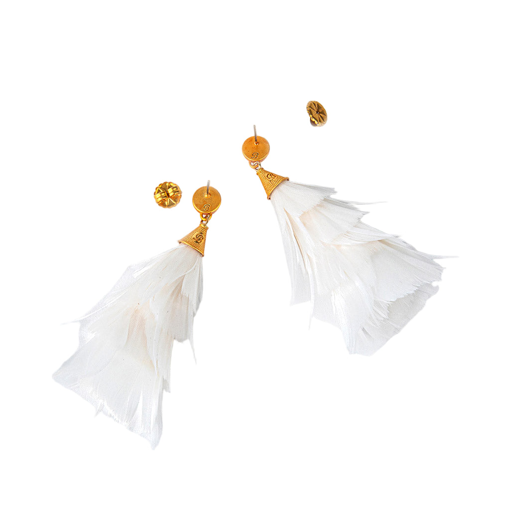 White feather earrings with gold accents on a white background