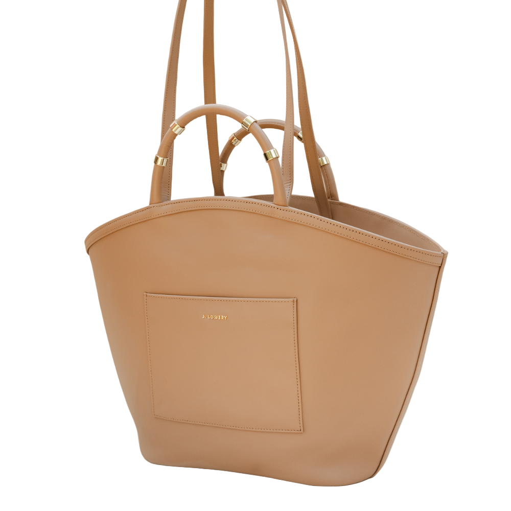 Beige handbag with a visible brand logo on a beige background