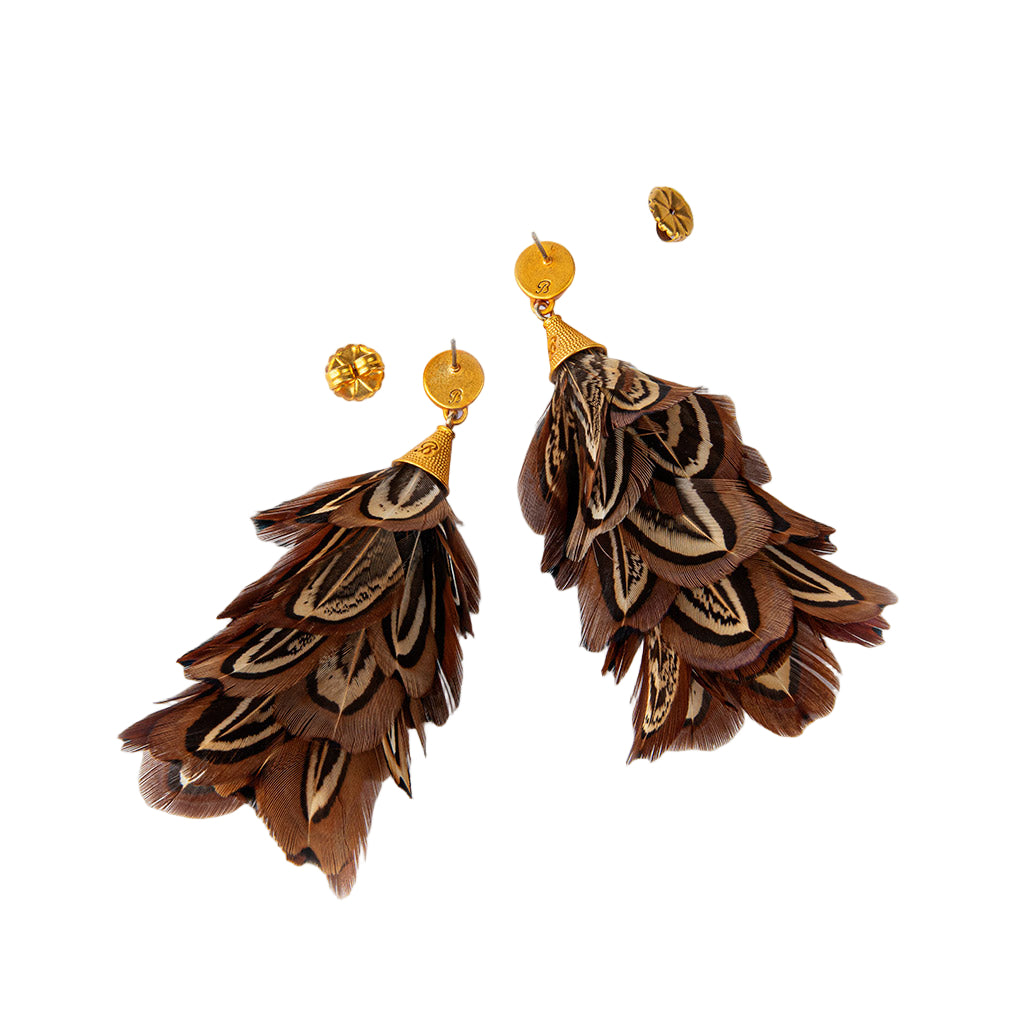 Brown feather earrings with gold accents on a white background
