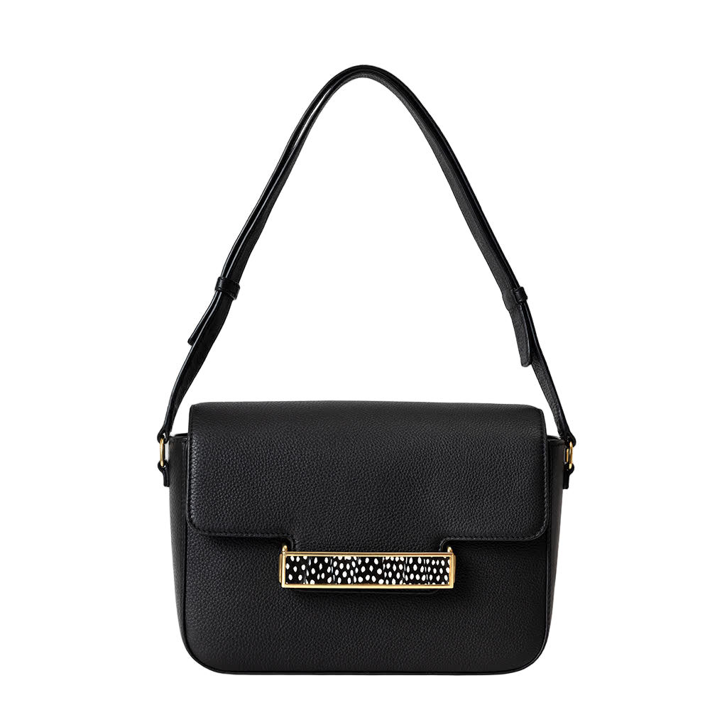 Black handbag with a decorative clasp on a white background