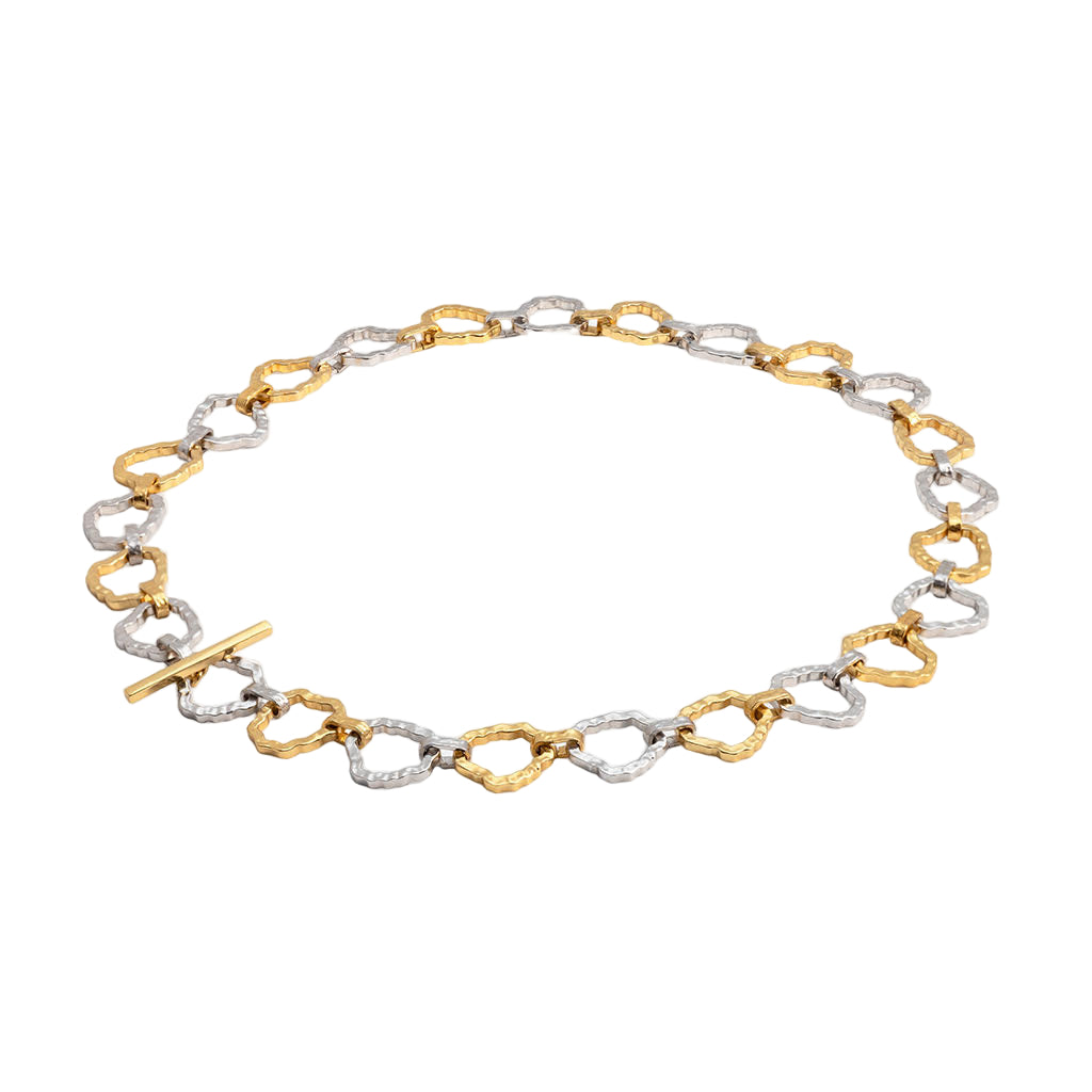 Bracelet with gold and silver links on a white background