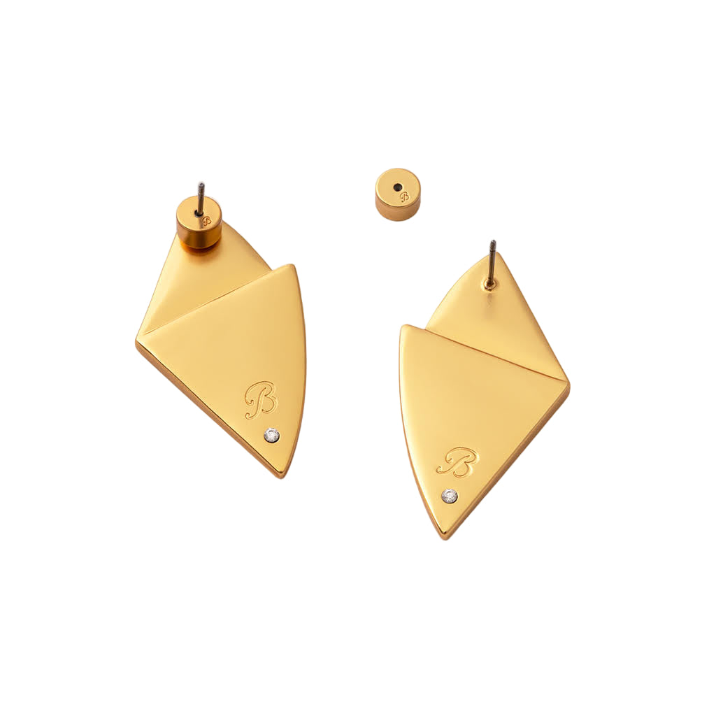 Gold geometric earrings on a white background