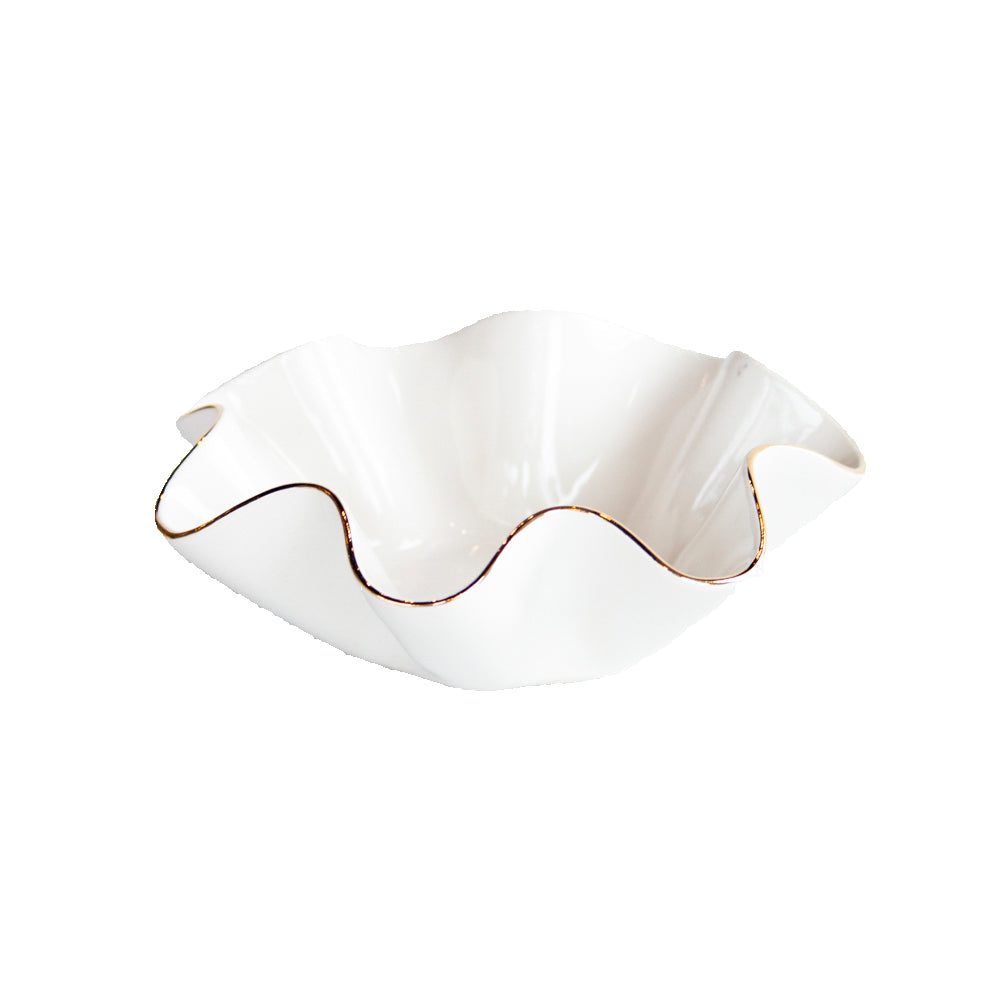 White ceramic dish with wavy edge on a light gray background