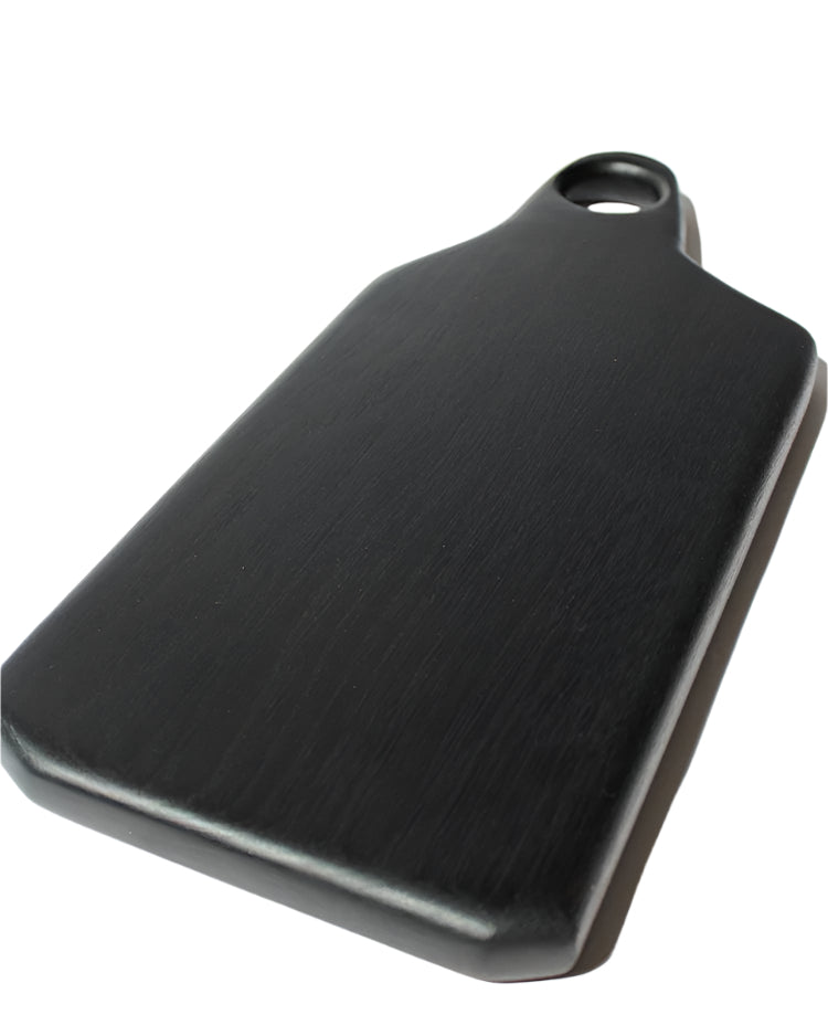 Black cutting board on a white background