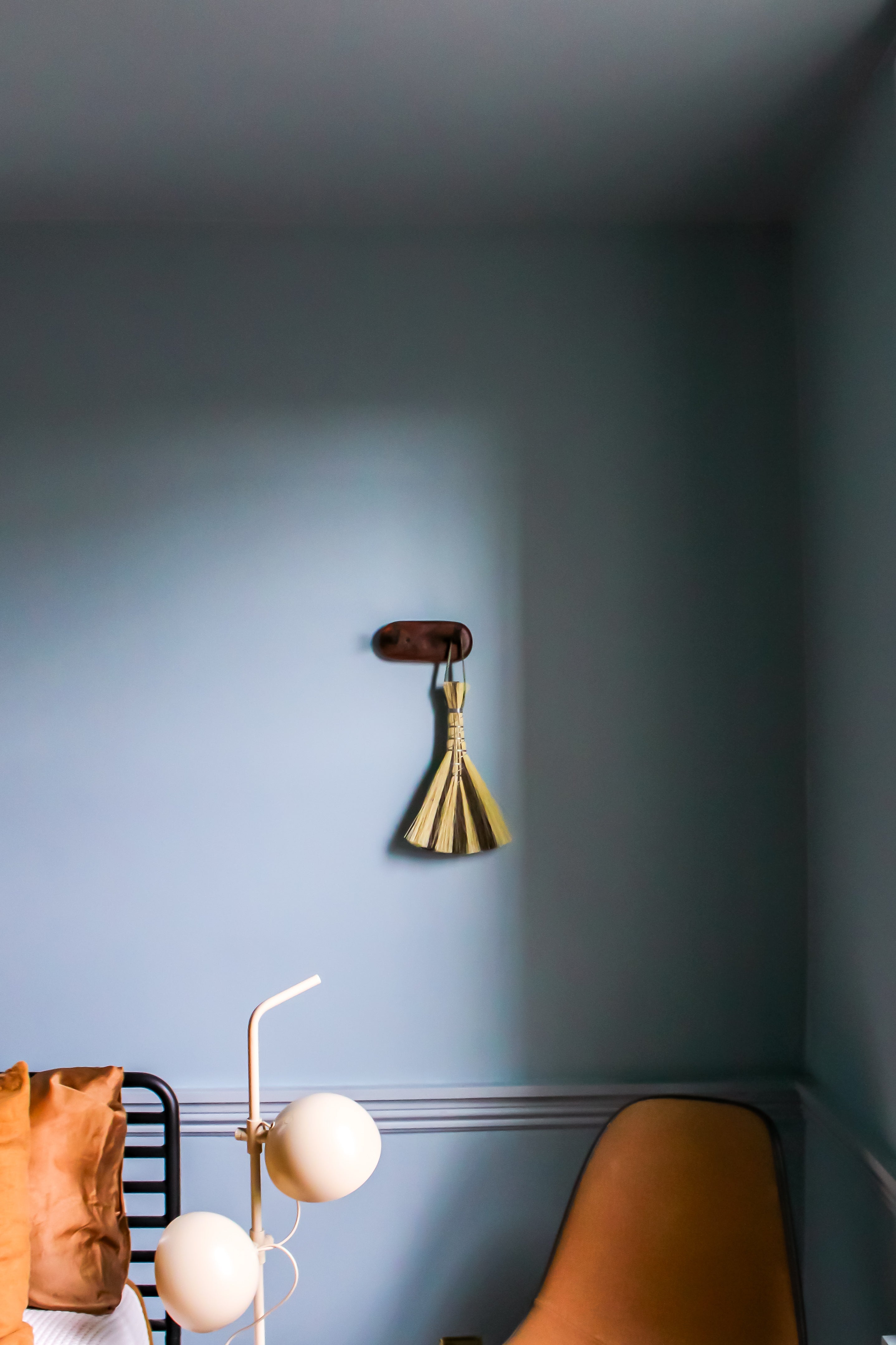 Metal wrapped brushes and brooms