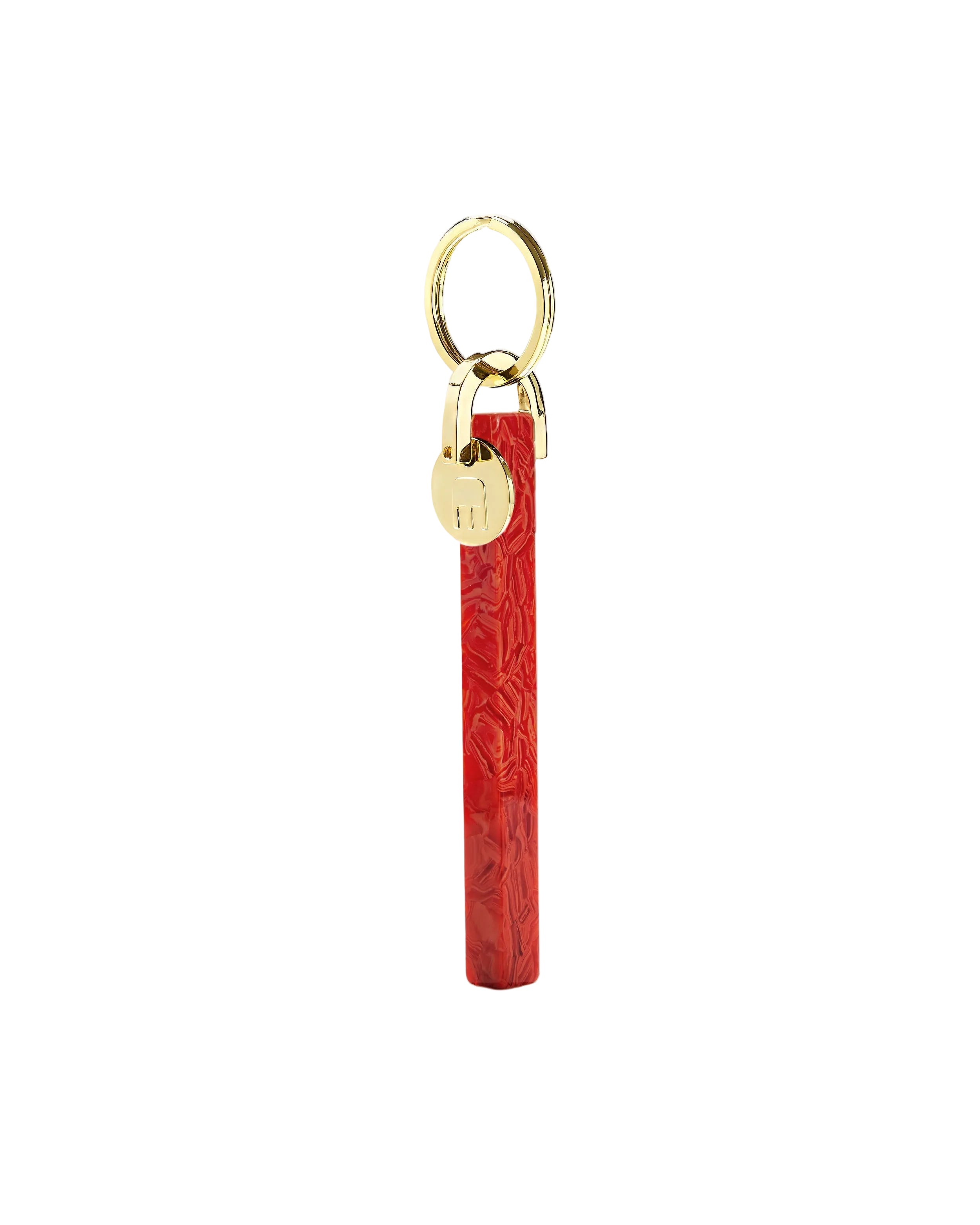Red keychain with gold lock and ring on a white background