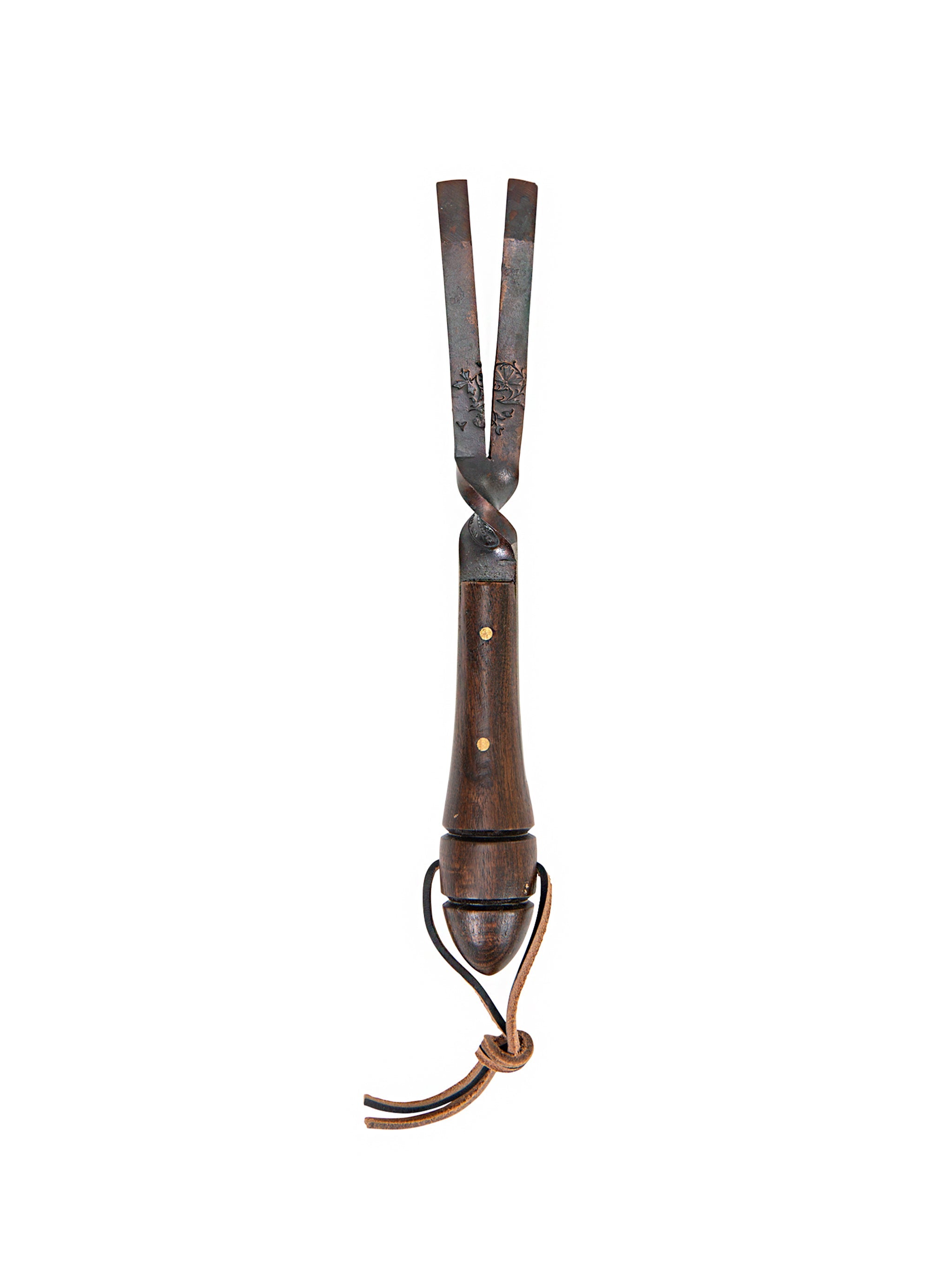 Decorative metal tool with wooden handle on a white background