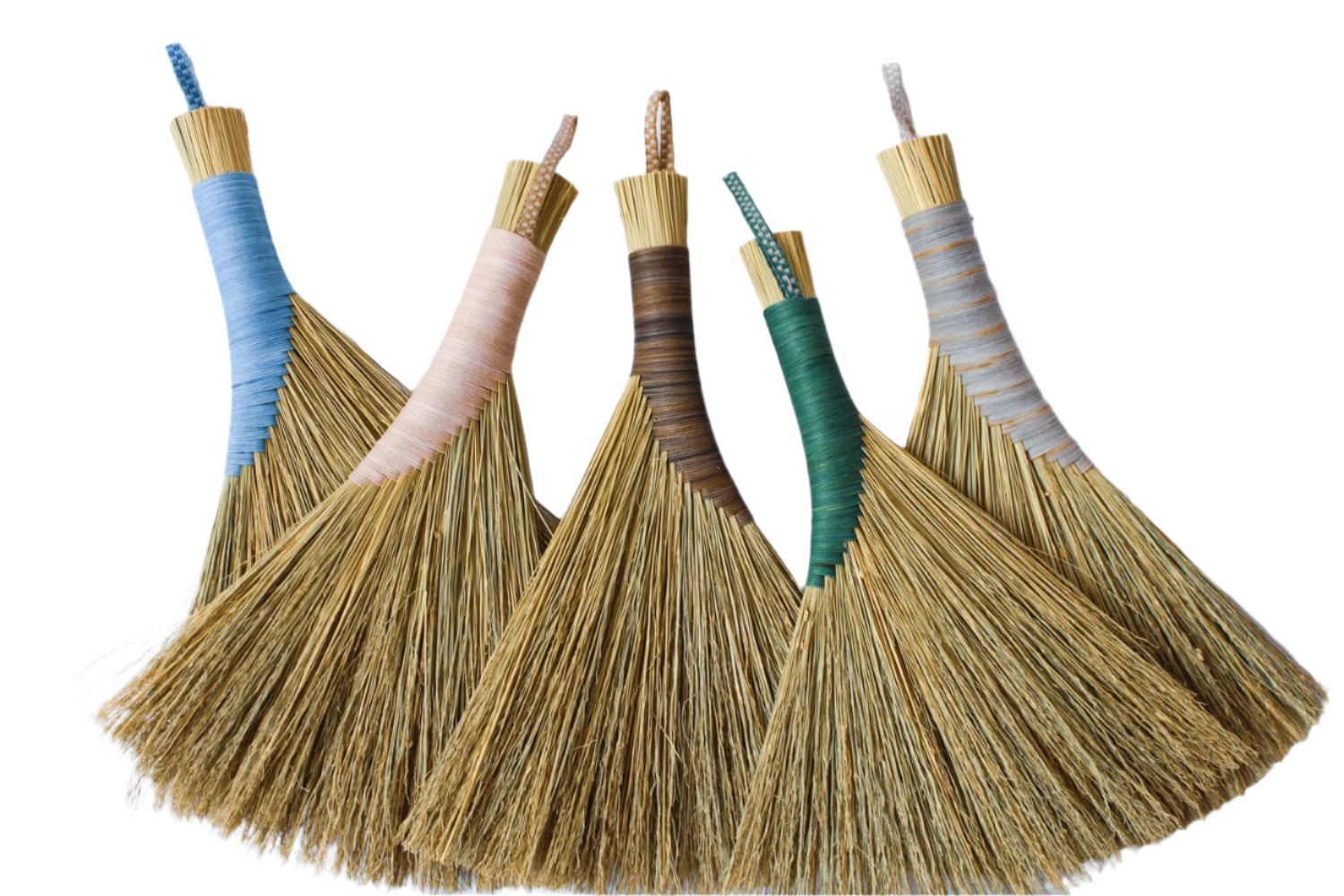 Four brooms with colorful handles on a white background