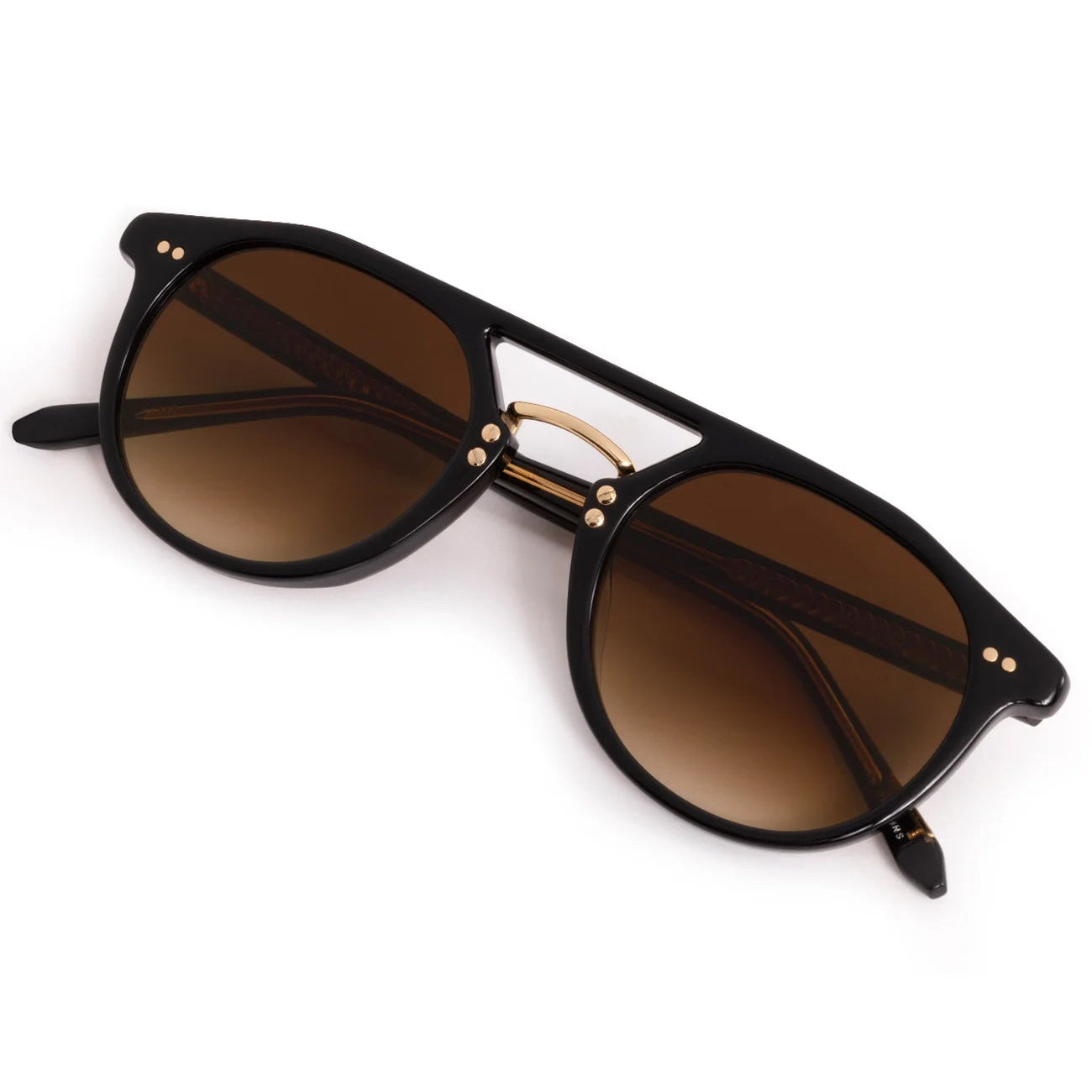 Black sunglasses with gold accents on a white background