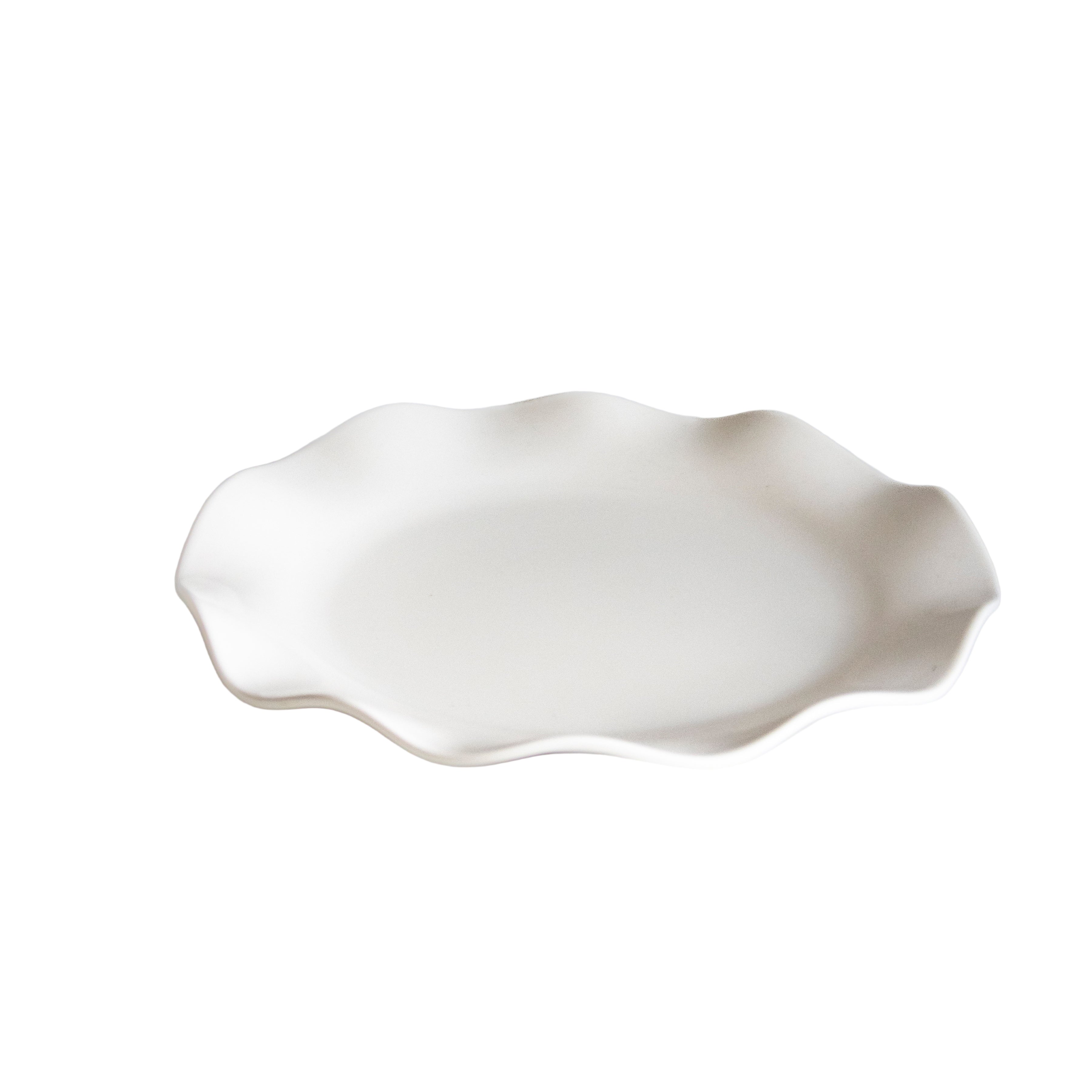 White ceramic dish on a light gray background