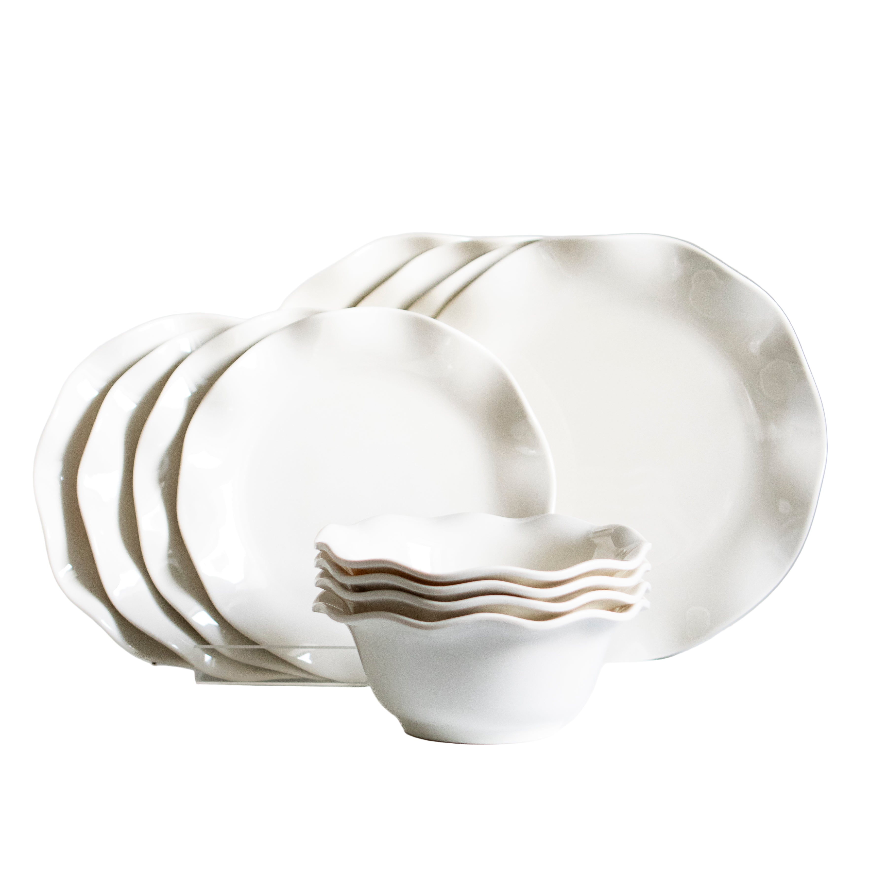 Set of white ceramic plates and bowls on a light gray background