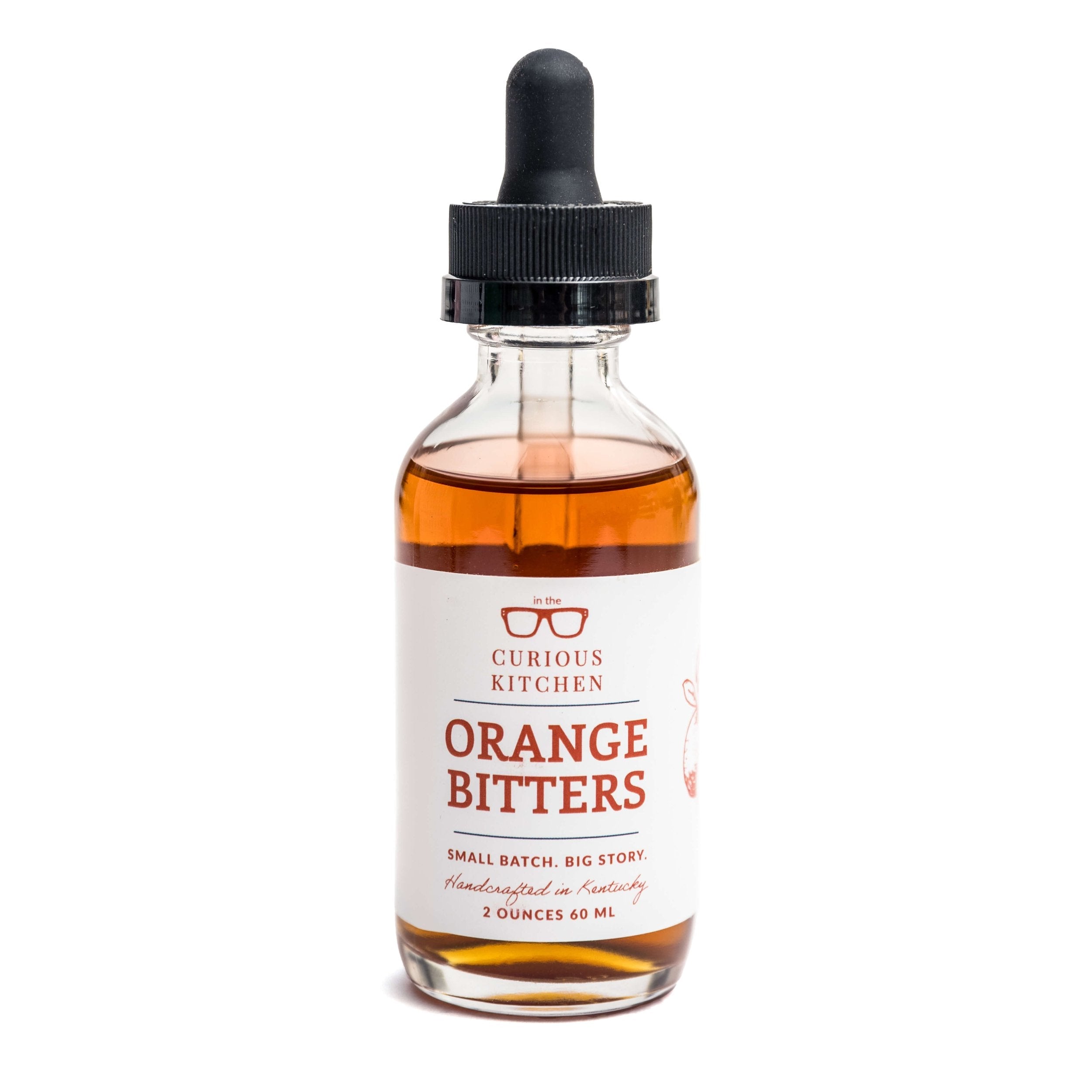 Bottle of Orange Bitters from The Curious Kitchen on a white background