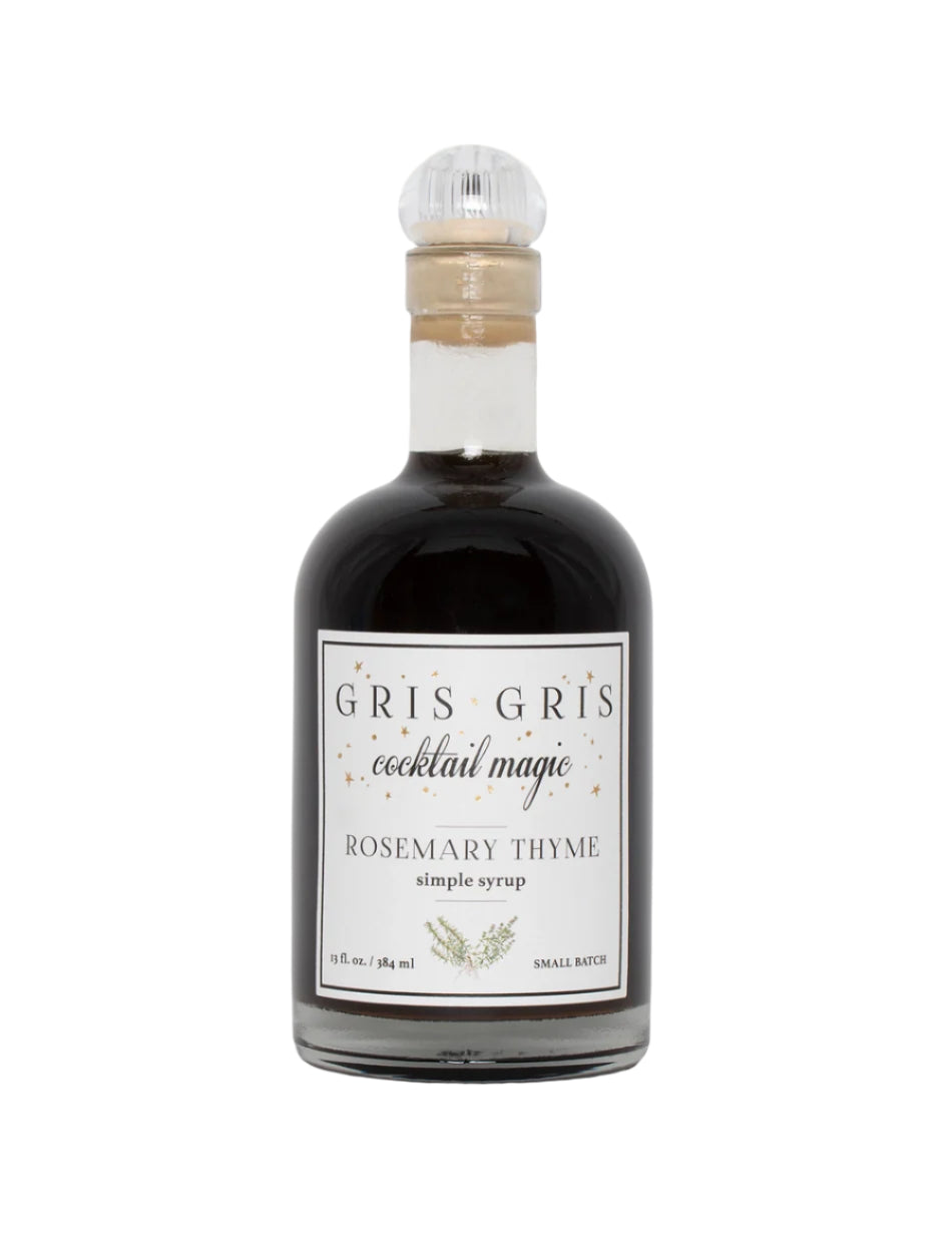 Bottle of Gris Gris cocktail magic rosemary thyme simple syrup on a white background