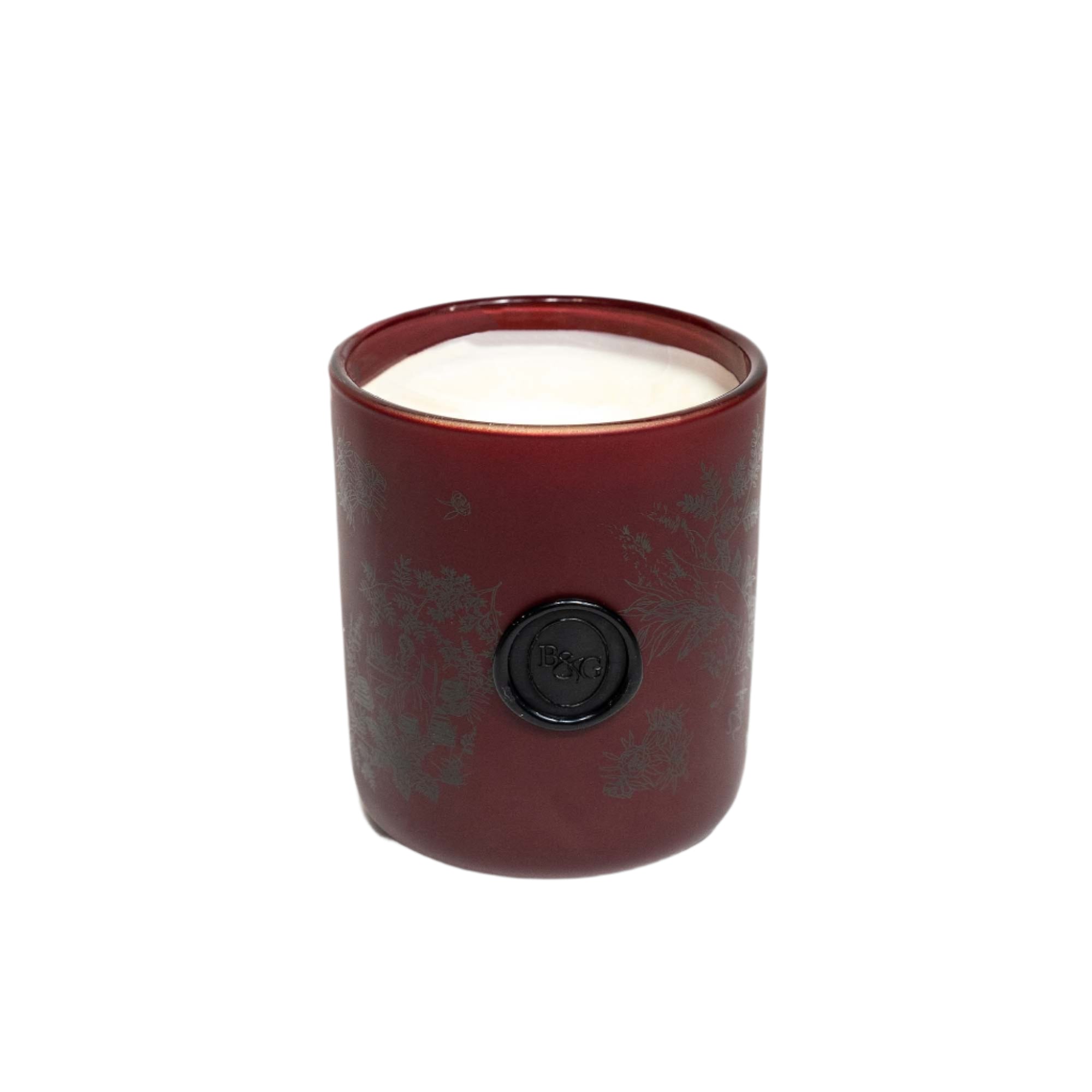 Red candle with a black lid on a white background