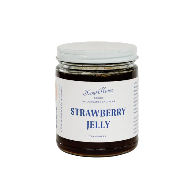 Jar of strawberry jelly with a label on a white background