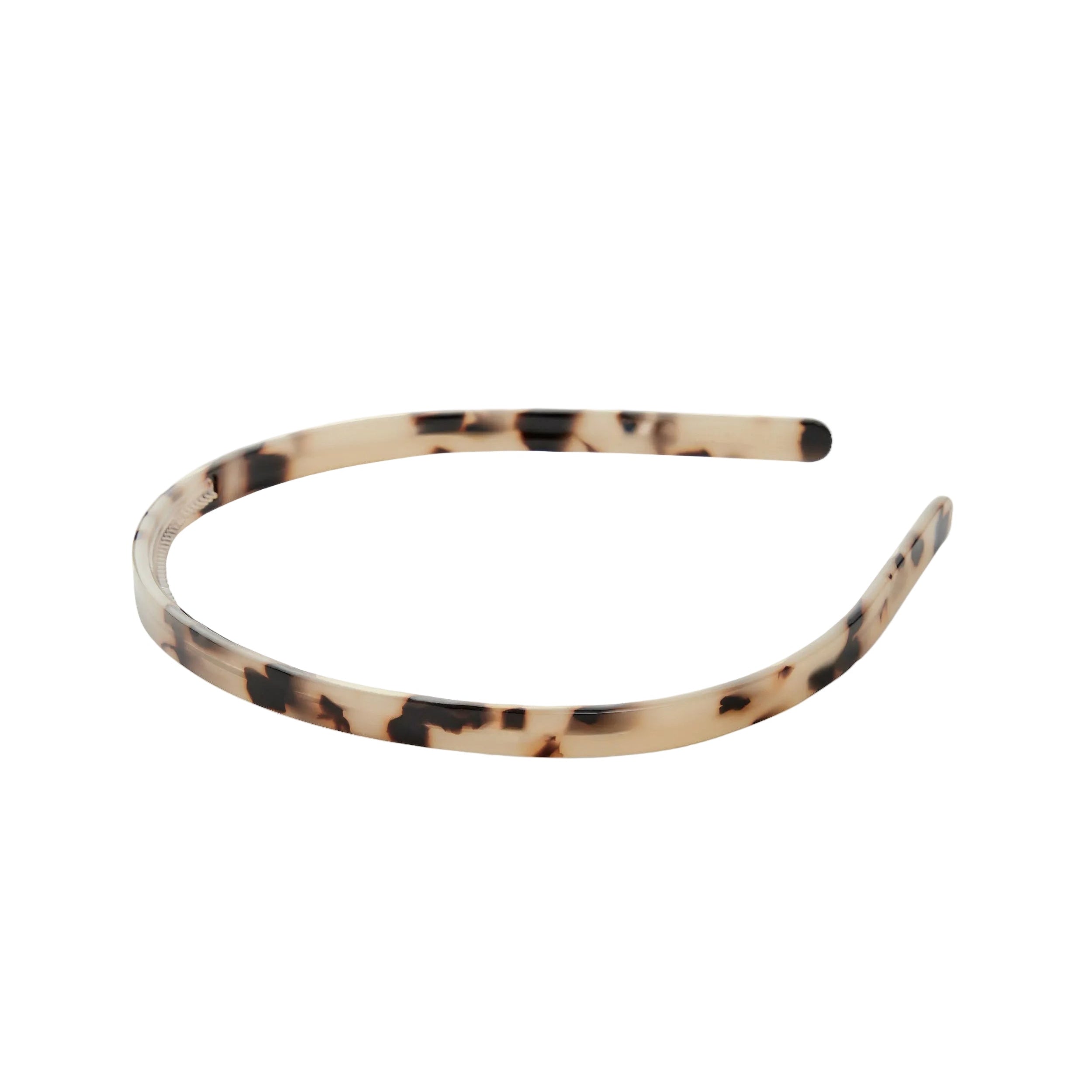 Tortoiseshell patterned headband on a white background