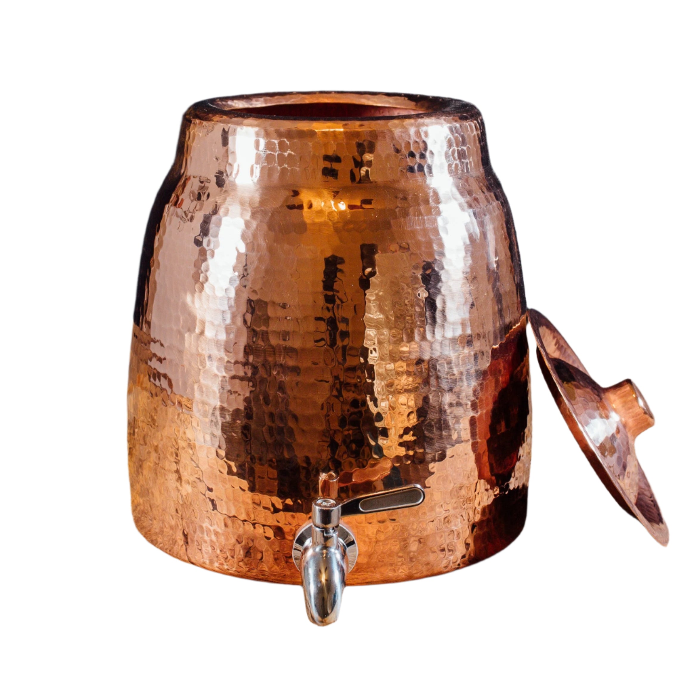 Copper container with a spout on a wooden surface