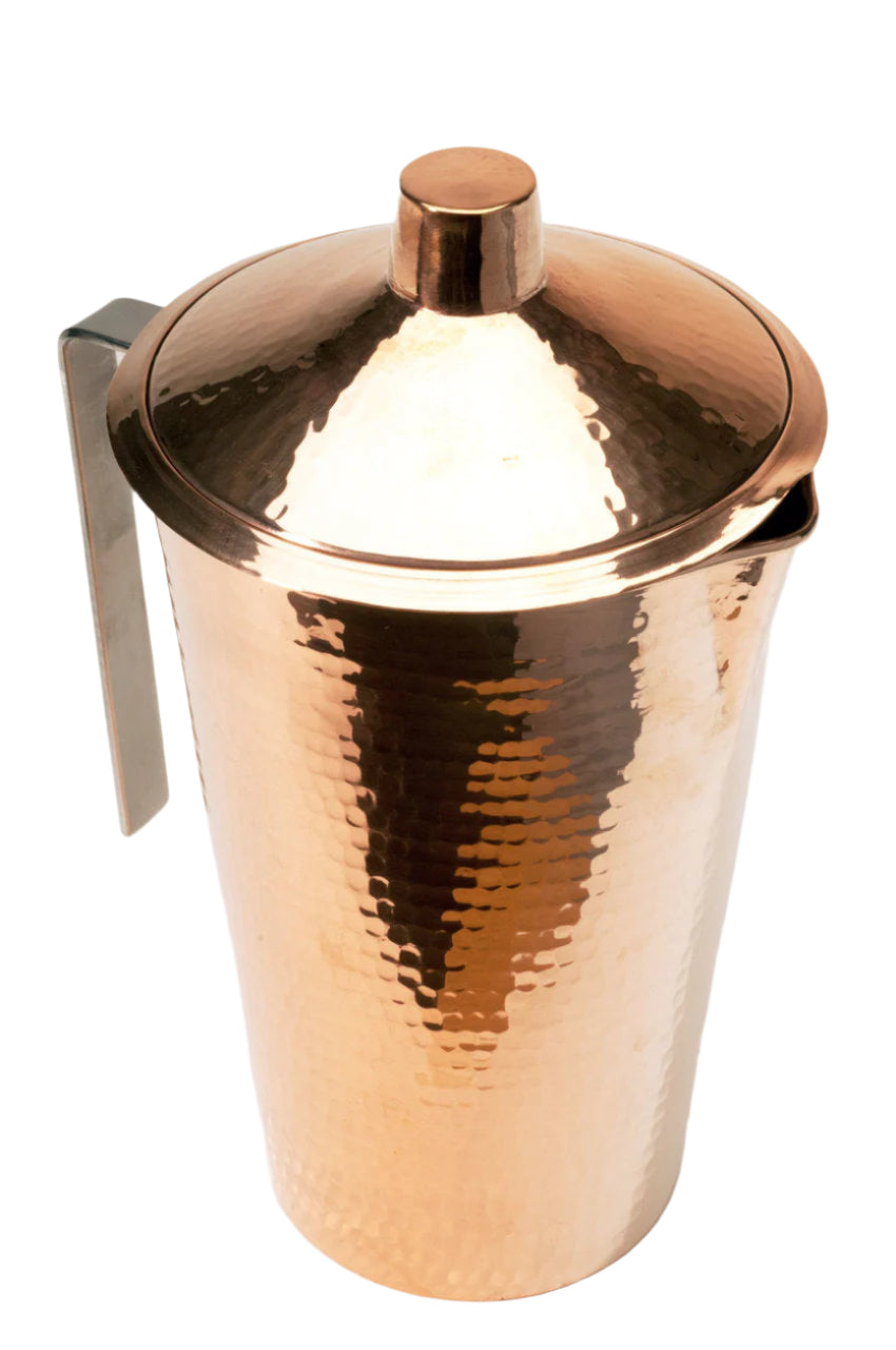 Copper cocktail shaker with a lid on a white background