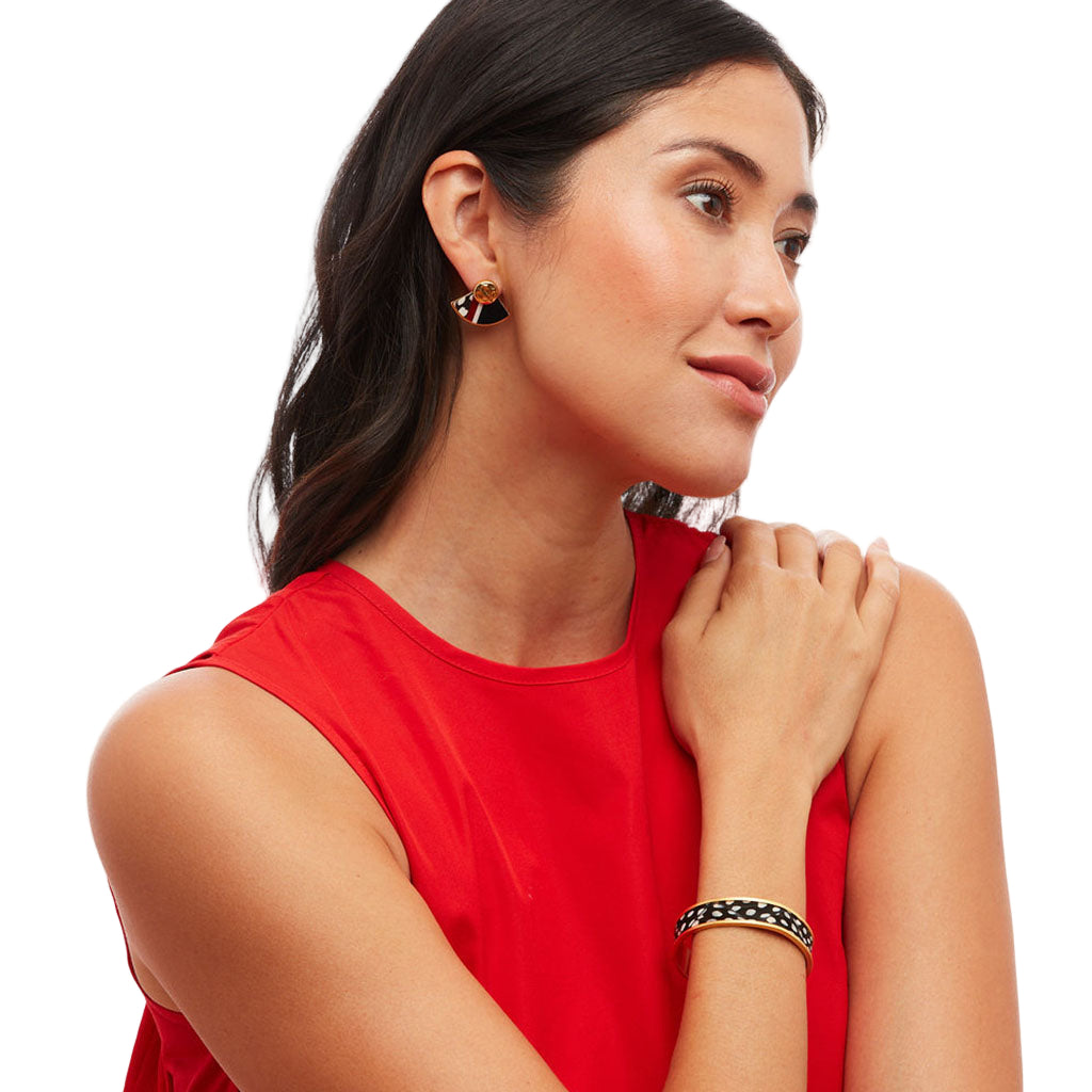 Woman wearing a red top with jewelry on a white background