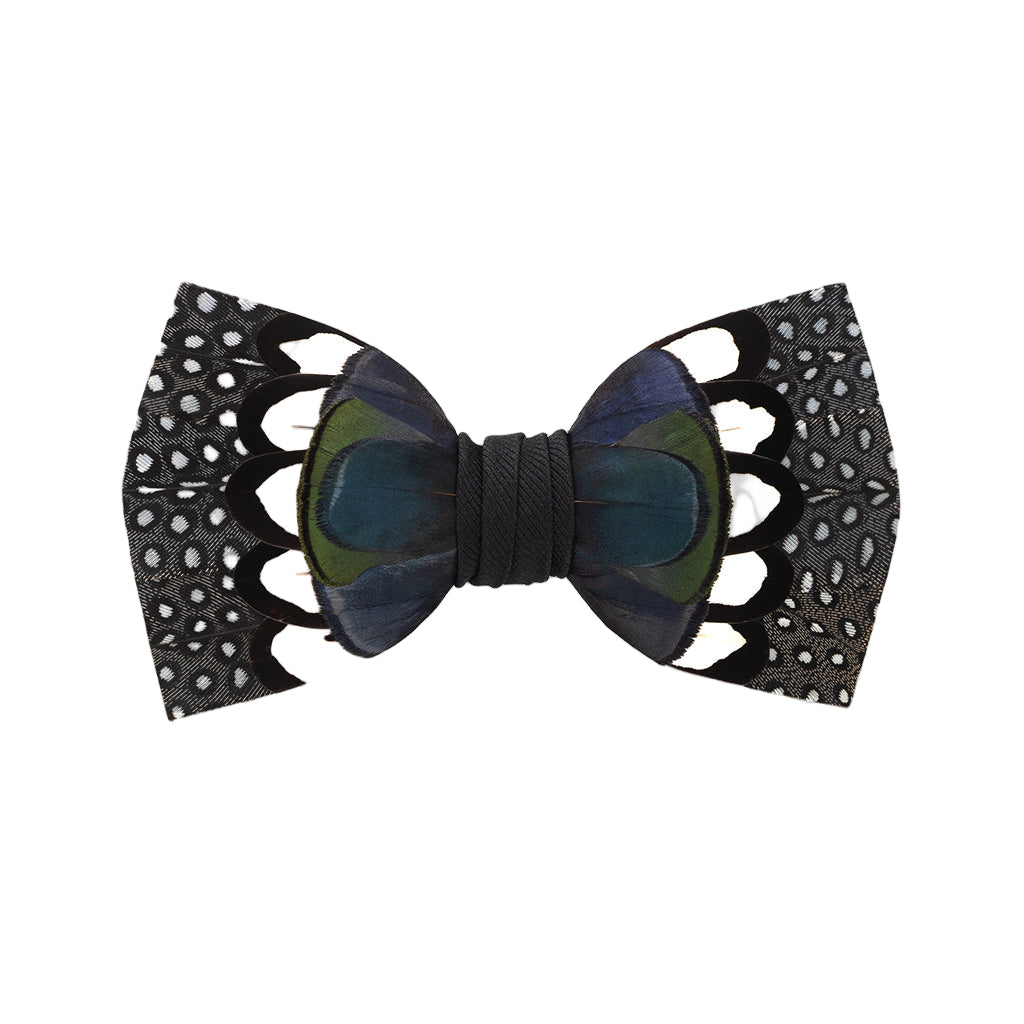 Bow tie with black lace-like design on a white background