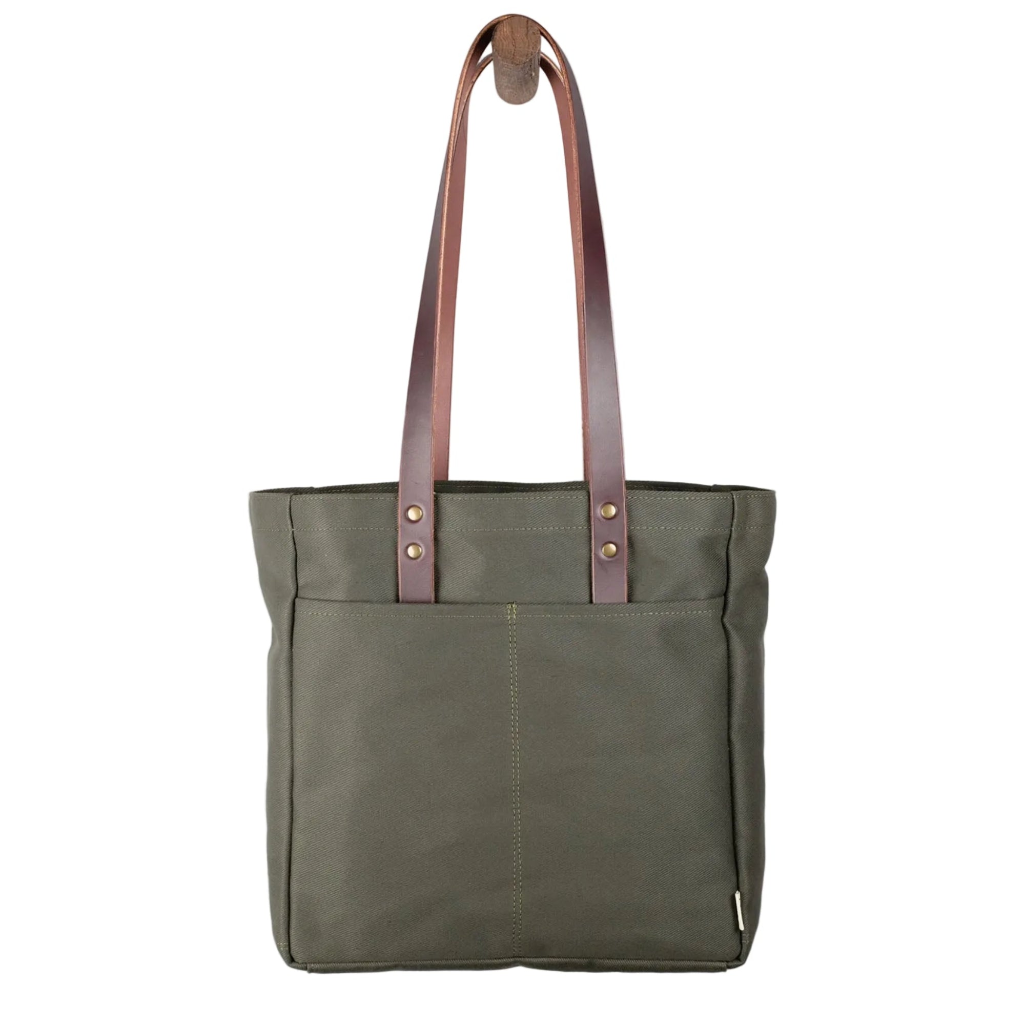 Green tote bag with brown leather straps on a light gray background