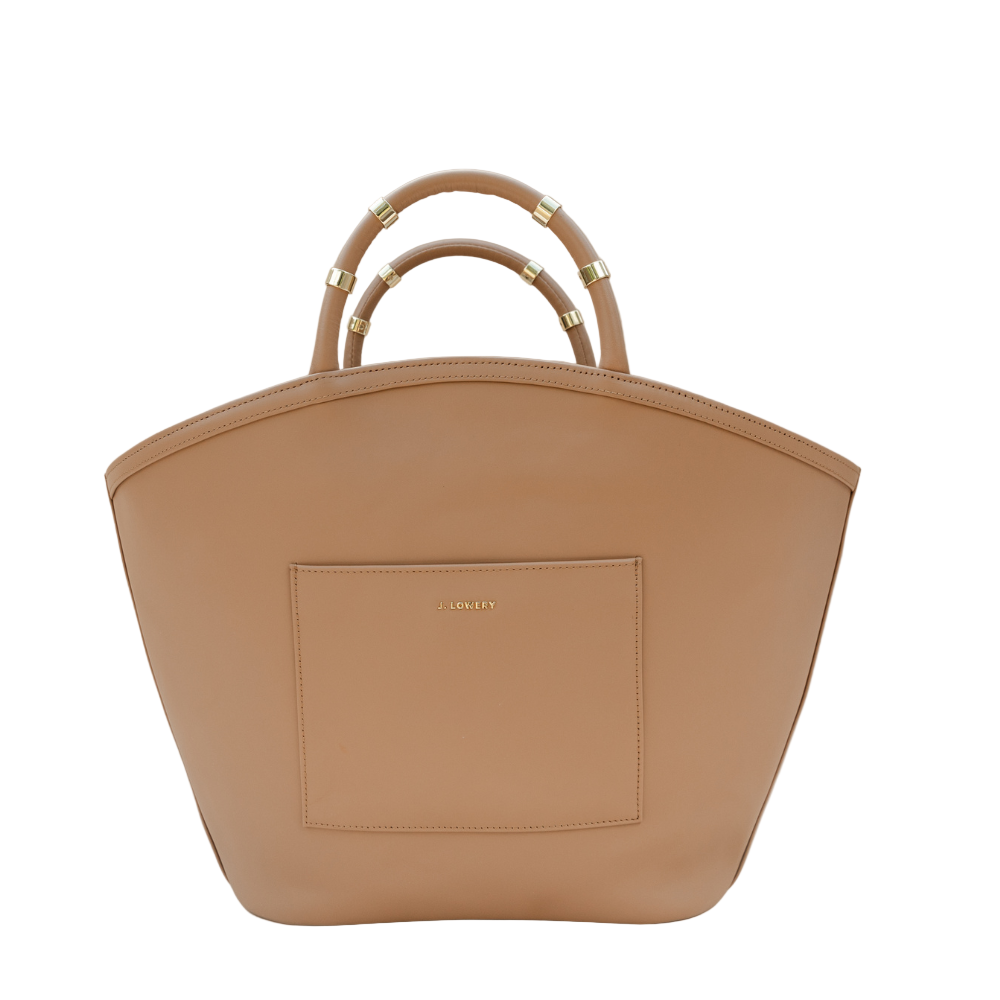Tan handbag with gold accents on a beige background