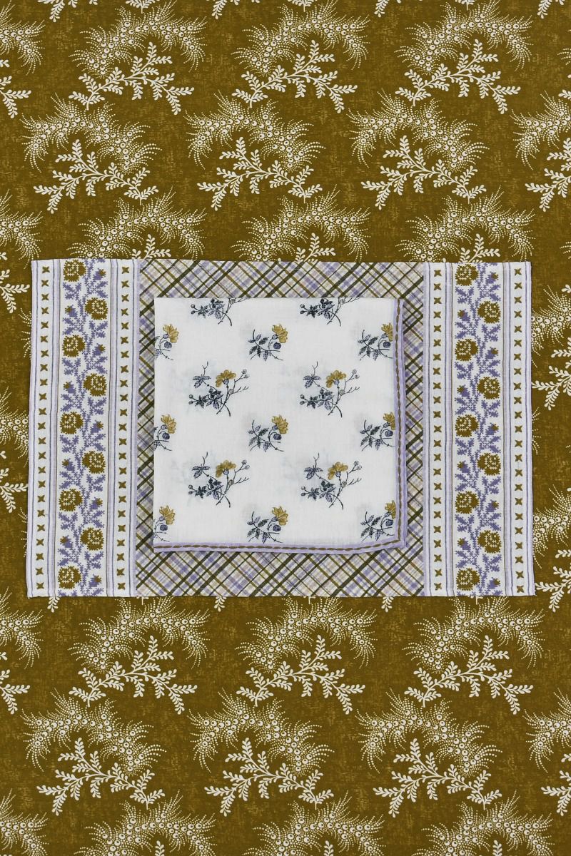 Tablecloth with floral and plaid patterns on a brown background